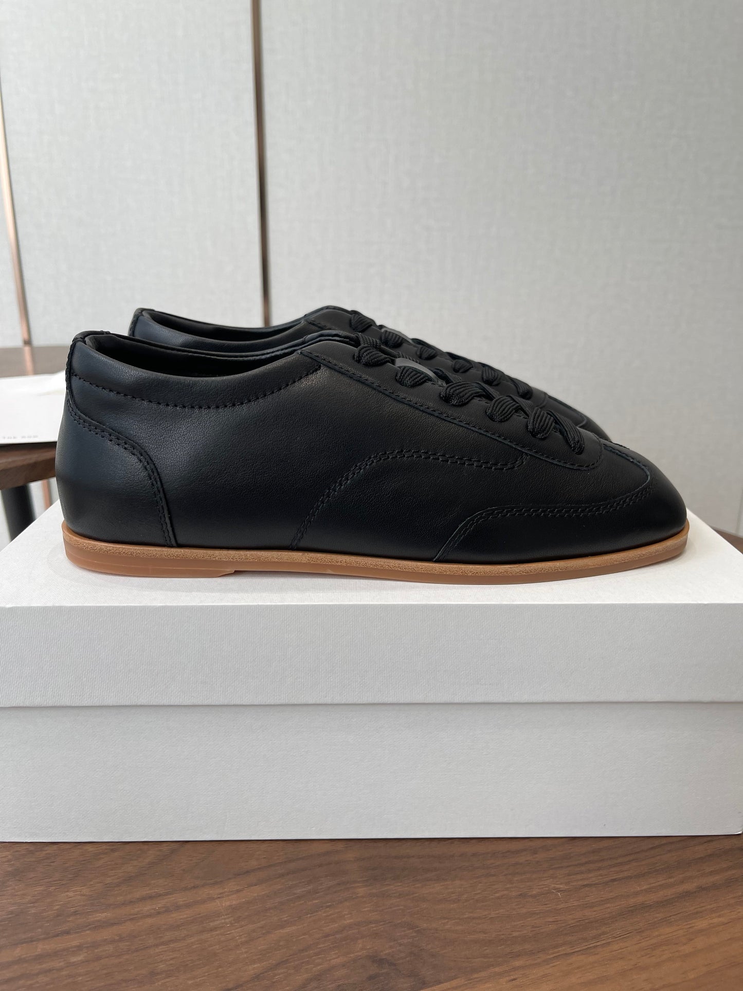 THE ROW 26S SNEAKERS IN BLACK CALFSKIN