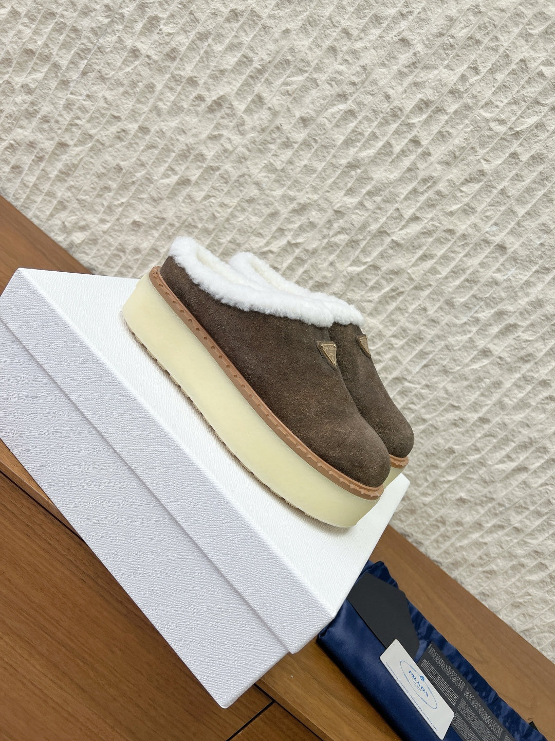 PRADA 25S PLATFORM FUR-LINED MULES IN EARTH BROWN SUEDE - 35