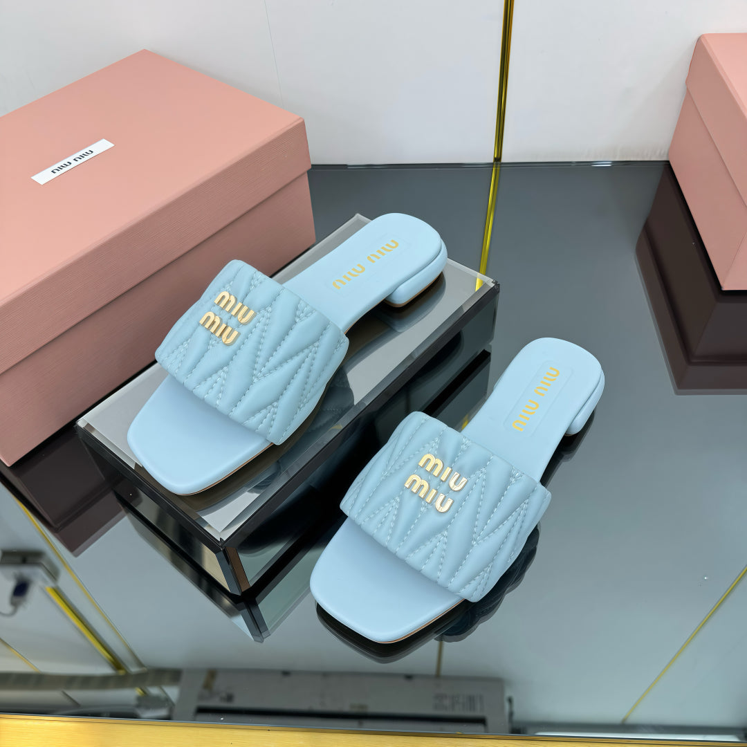 MATELASSÉ SLIDES IN BABY BLUE CALFSKIN - 35