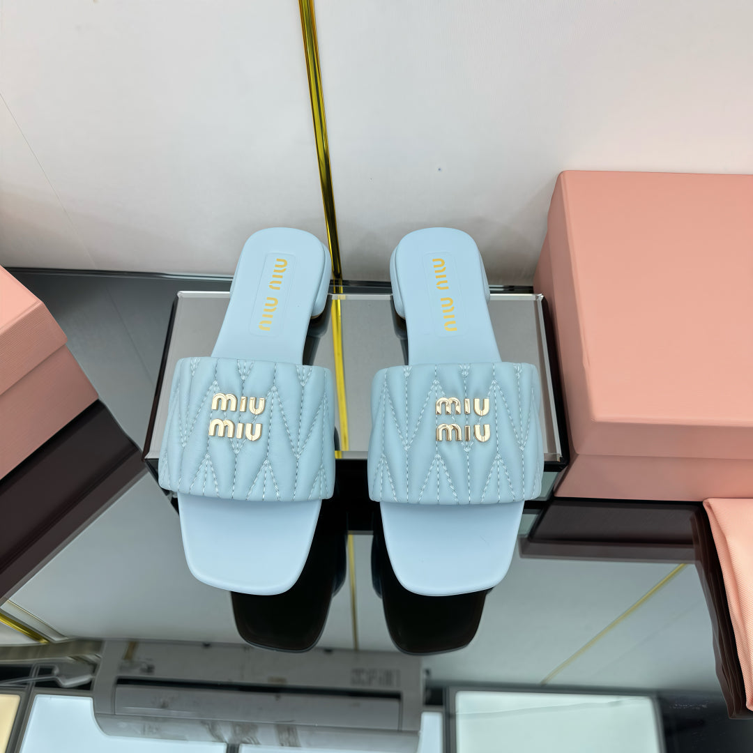 MATELASSÉ SLIDES IN BABY BLUE CALFSKIN - 35