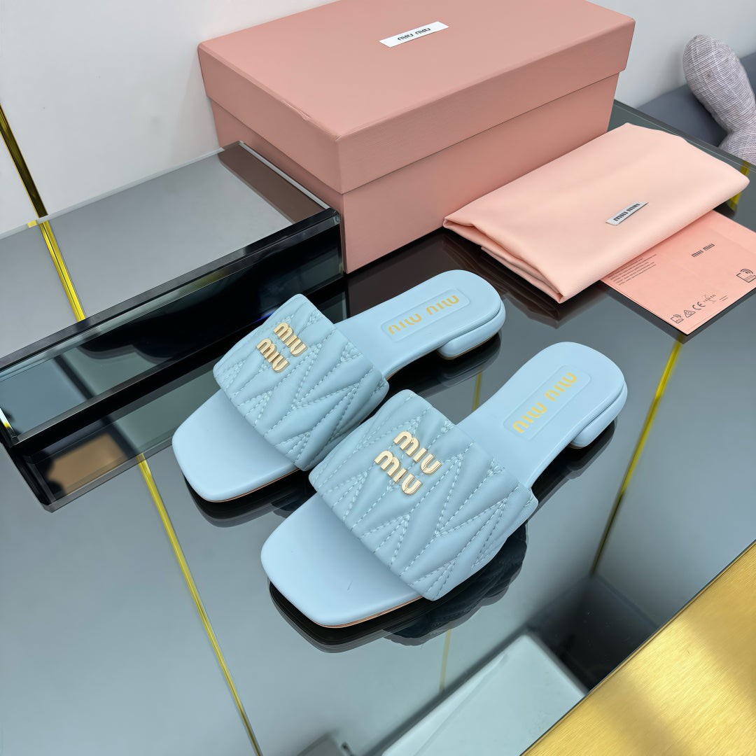 MATELASSÉ SLIDES IN BABY BLUE CALFSKIN - 35