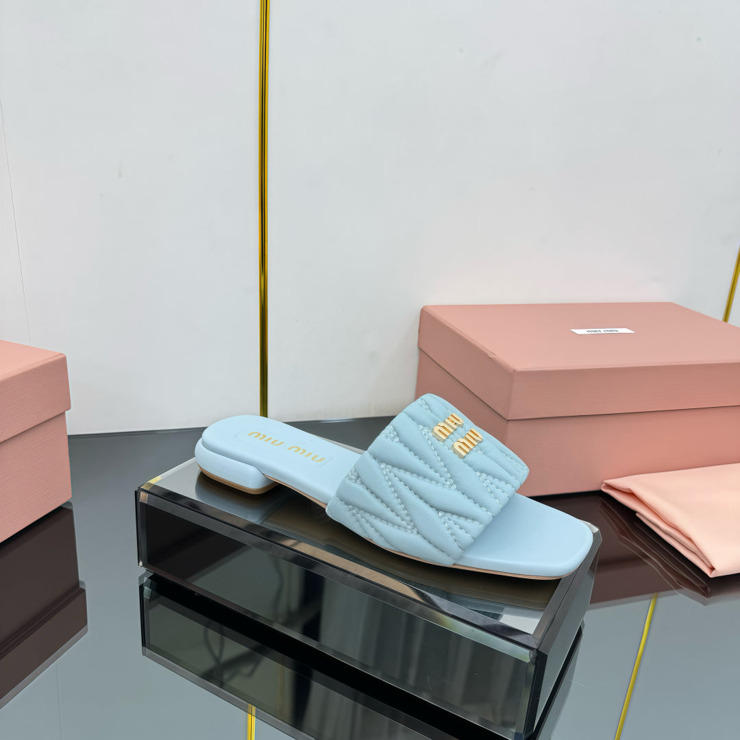 MATELASSÉ SLIDES IN BABY BLUE CALFSKIN - 35