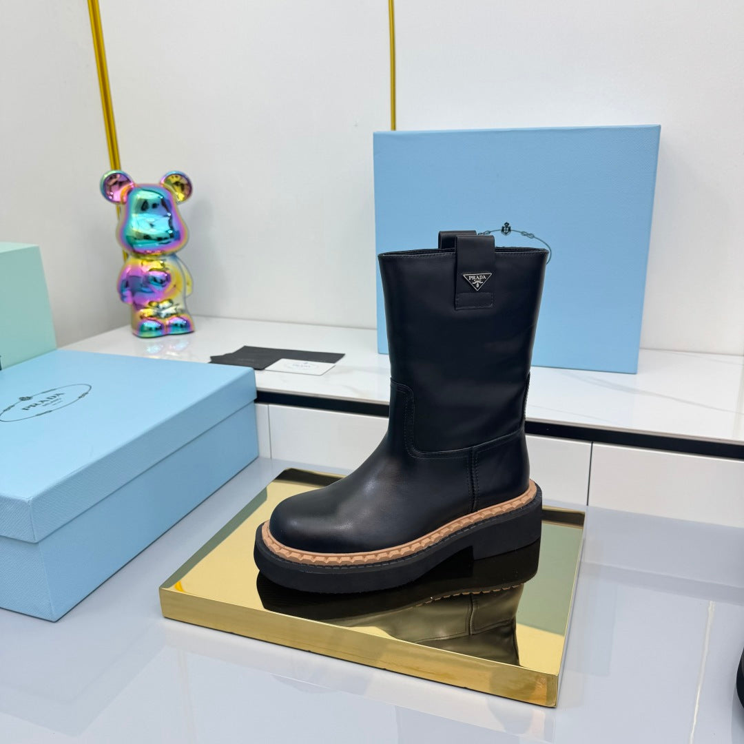PRADA 25S HIGH MARTIN BOOTS 50MM IN BLACK CALFSKIN - 35