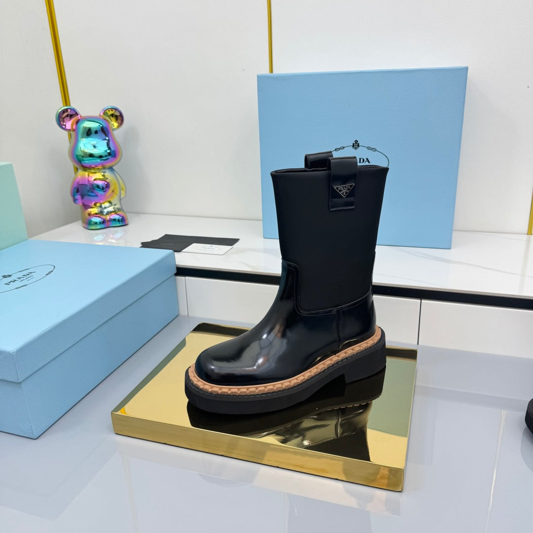 PRADA 25S HIGH MARTIN BOOTS 50MM IN BLACK GLOSSY CALFSKIN - 35