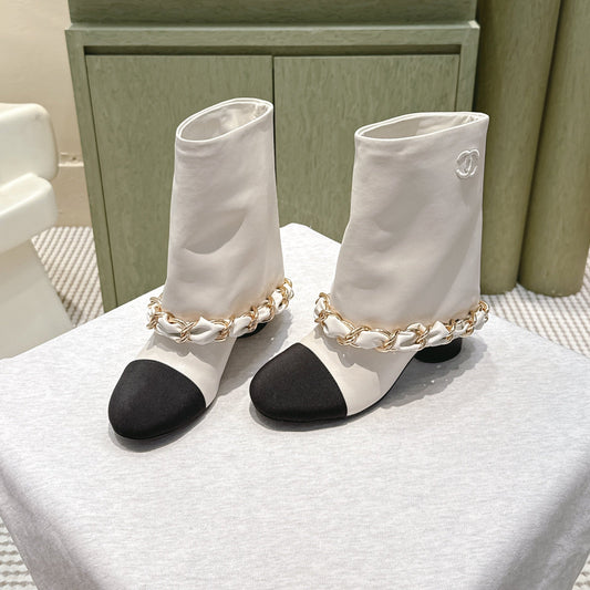 CHANEL 25S CALF-LENGTH BOOTS 45MM IN WHITE AND BLACK CALFSKIN GOLD HARDWARE - 35
