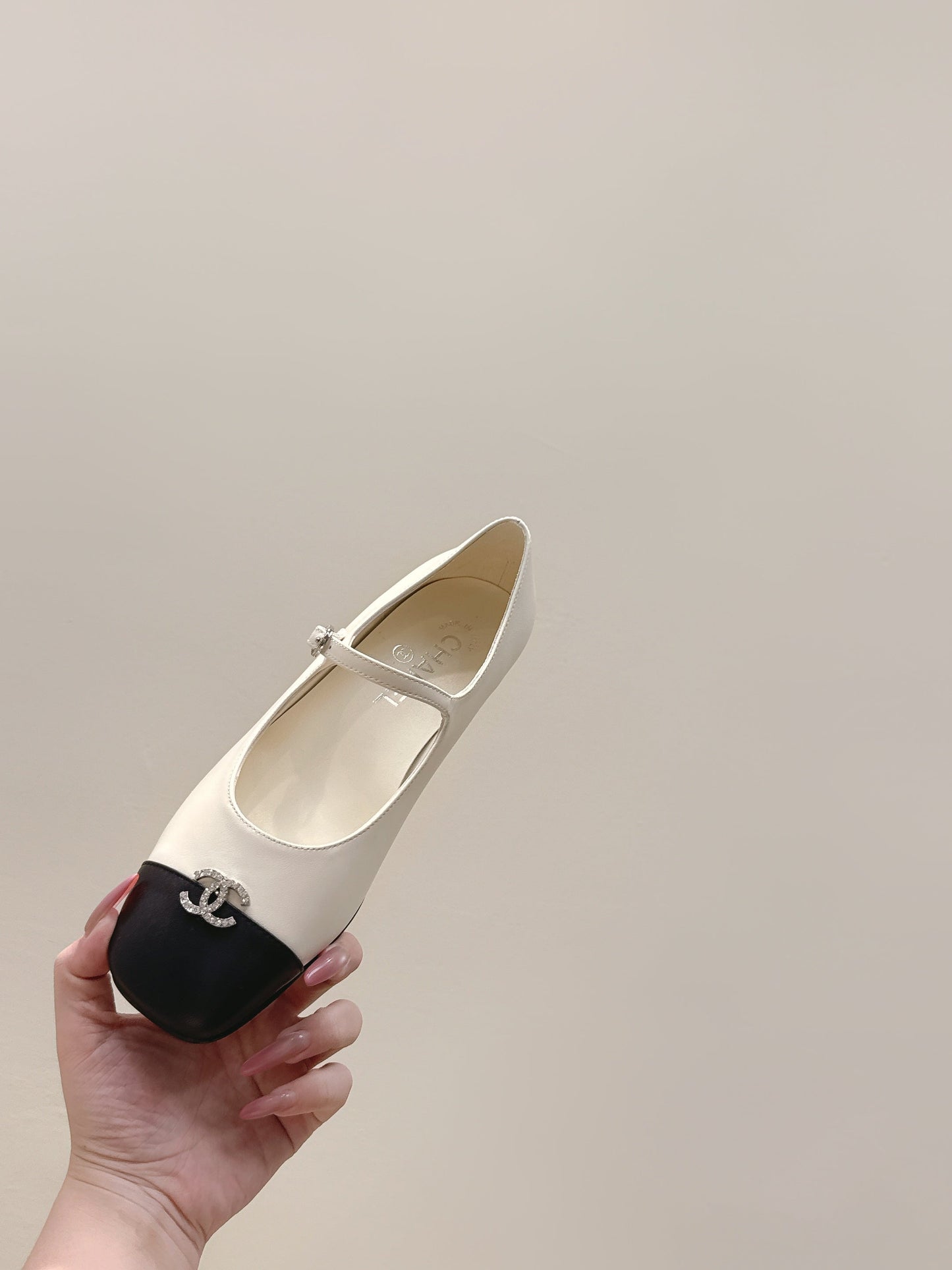 CHANEL 25S MARY JANE FLATS IN IVORY LAMBSKIN WITH BLACK CAP TOE SILVER HARDWARE - 35