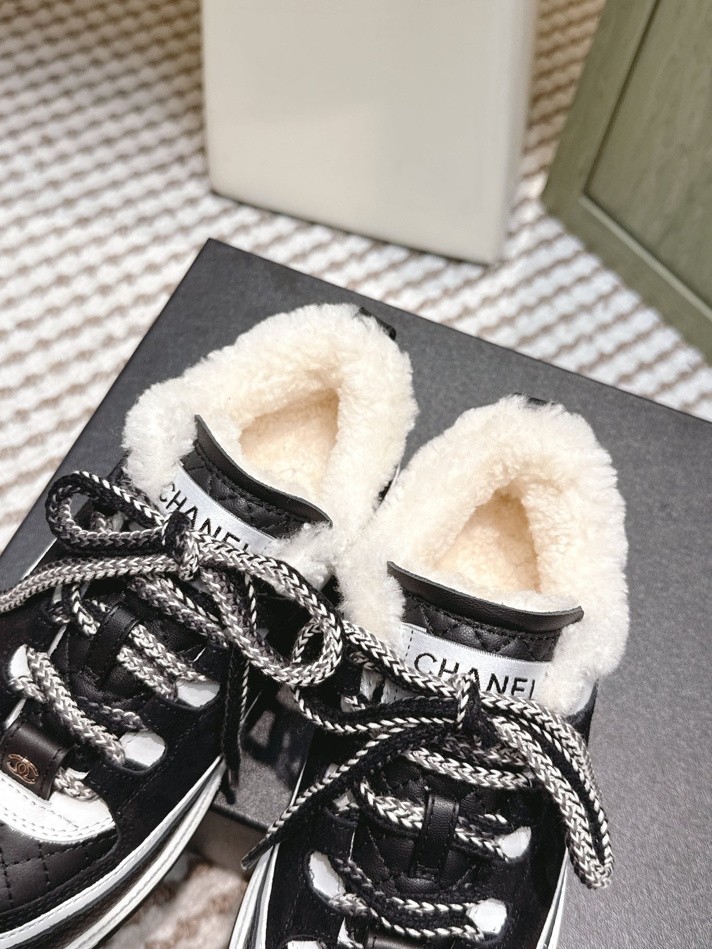 CHANEL 25S THICK-SOLE SNEAKERS IN BLACK AND WHITE CALFSKIN WITH FUR LINING - 35