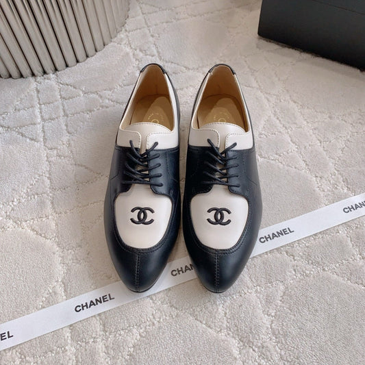 CHANEL 25S TWO TONE LACE UP IN BLACK AND WHITE CALFSKIN - 35