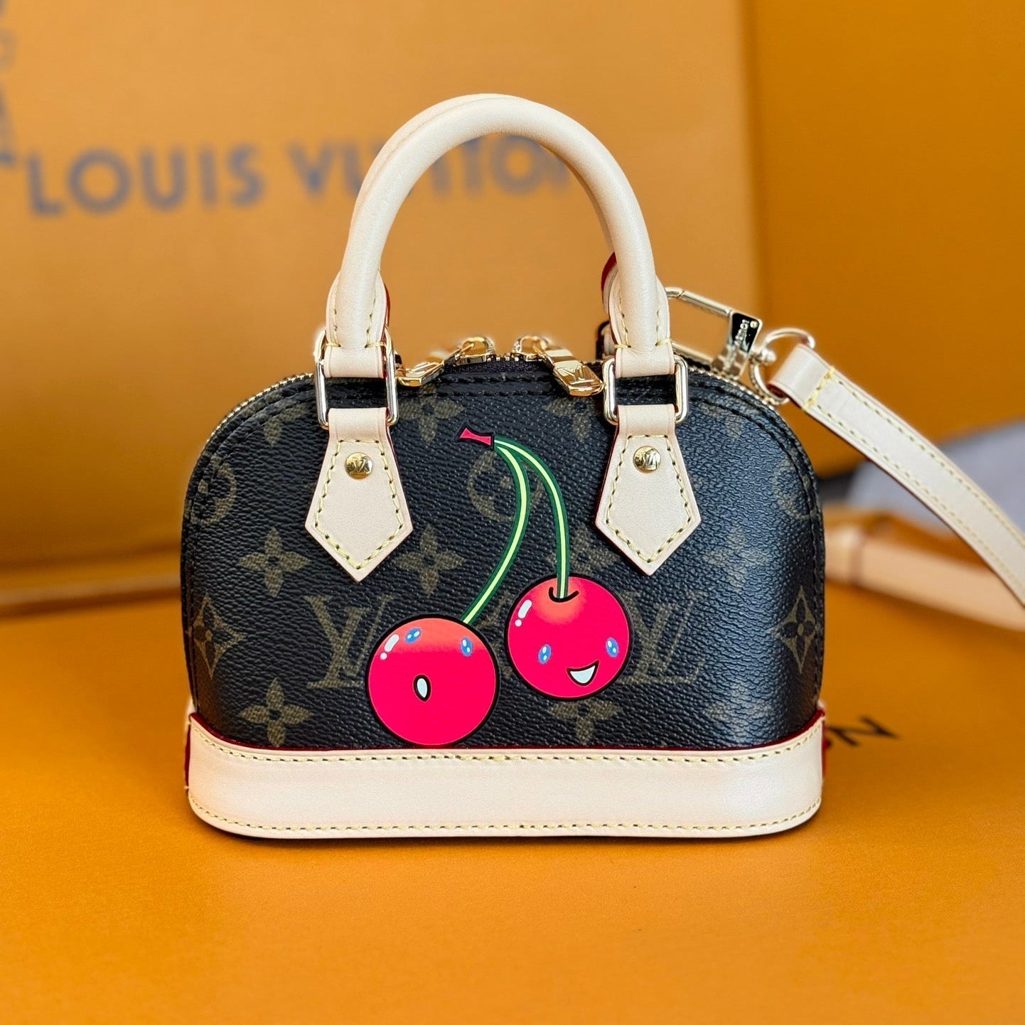 LV 25S NANO ALMA 18 IN DARK BROWN CANVAS MONOGRAM CHERRY PRINT GOLD HARDWARE