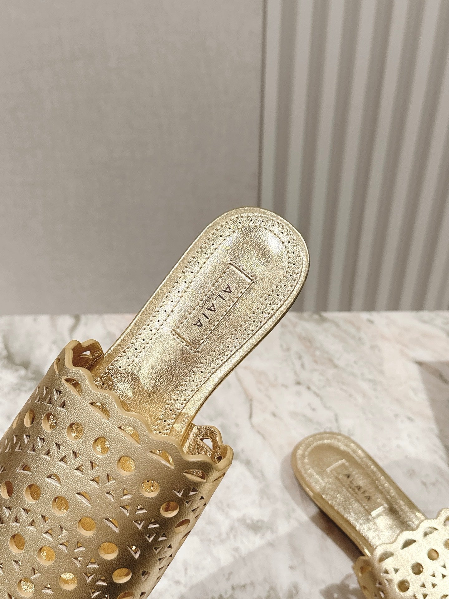 ALAIA PERFORATED SLIDE SANDALS 25S IN LIGHT GOLD LAMBSKIN - 35