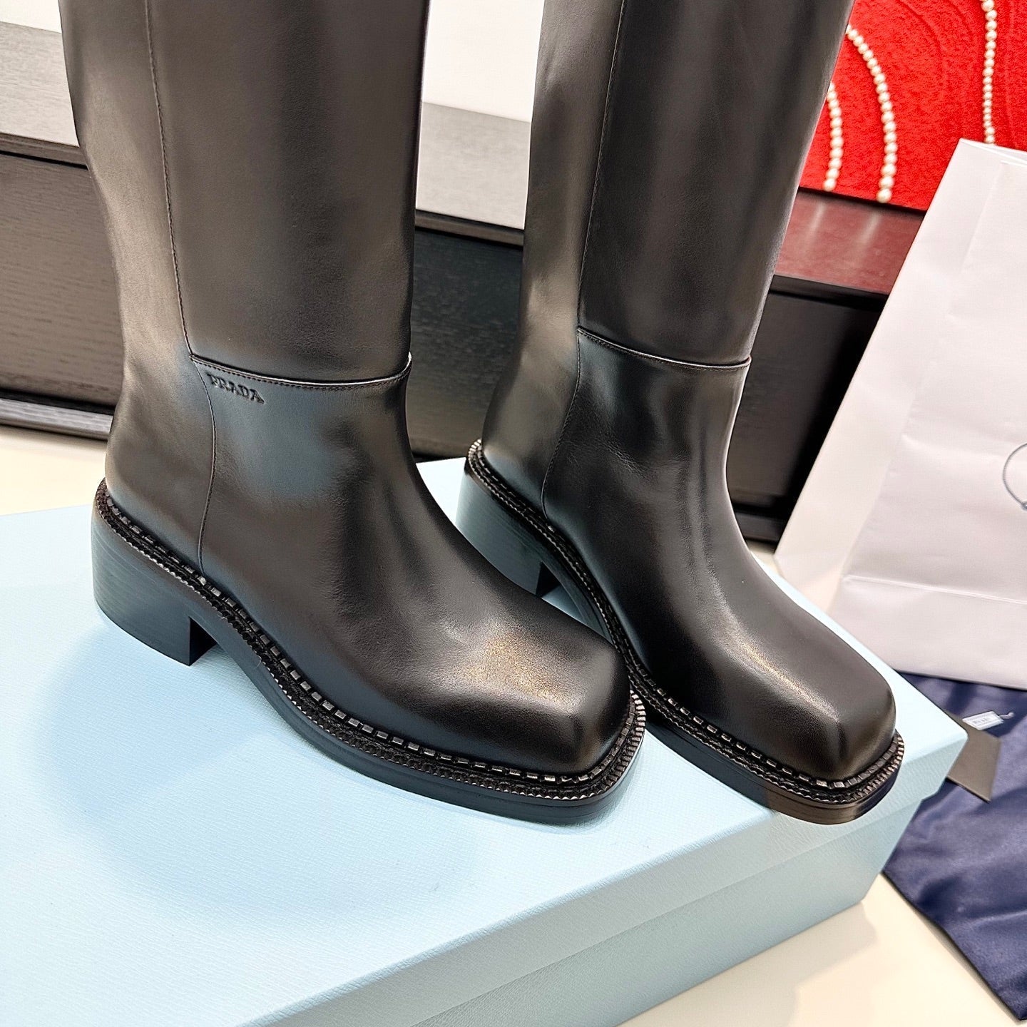 PRADA 25S SQUARE-TOE HIGH-CUT BOOTS IN BLACK CALFSKIN - 35
