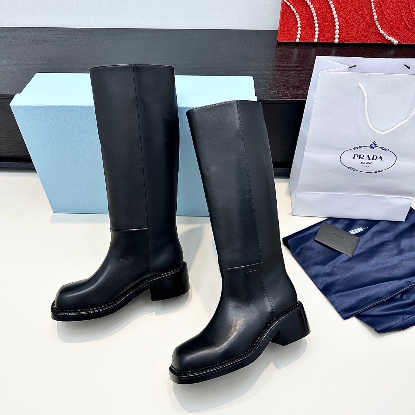 PRADA 25S SQUARE-TOE HIGH-CUT BOOTS IN BLACK CALFSKIN - 35