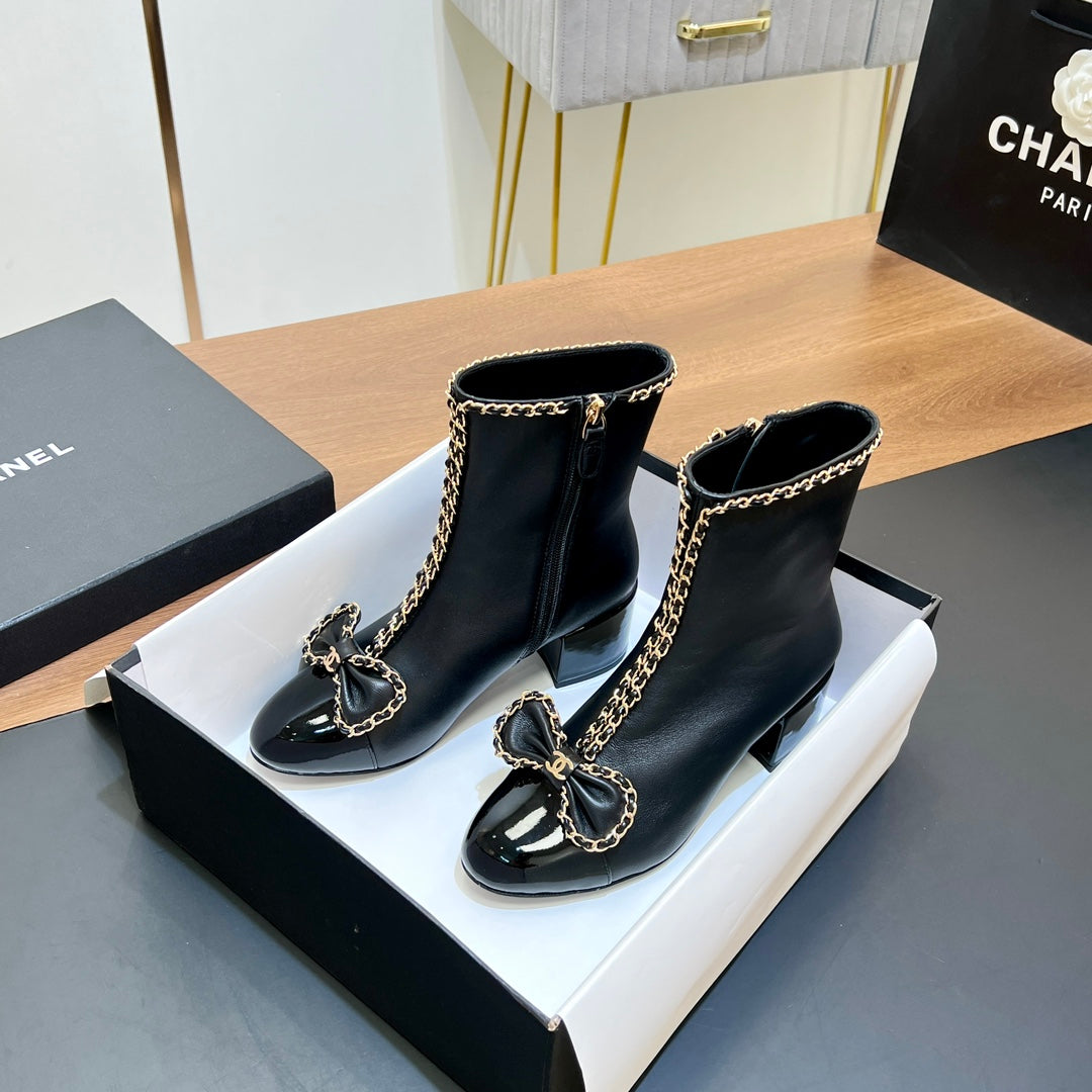 CHANEL 25S HEELED CHAIN BOOTS WITH BOW IN BLACK CALFSKIN GOLD HARDWRE - 35