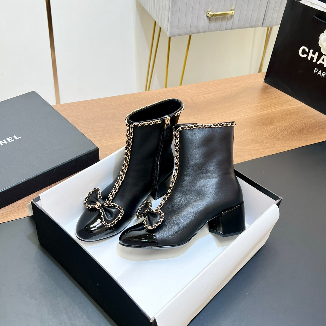 CHANEL 25S HEELED CHAIN BOOTS WITH BOW IN BLACK CALFSKIN GOLD HARDWRE - 35