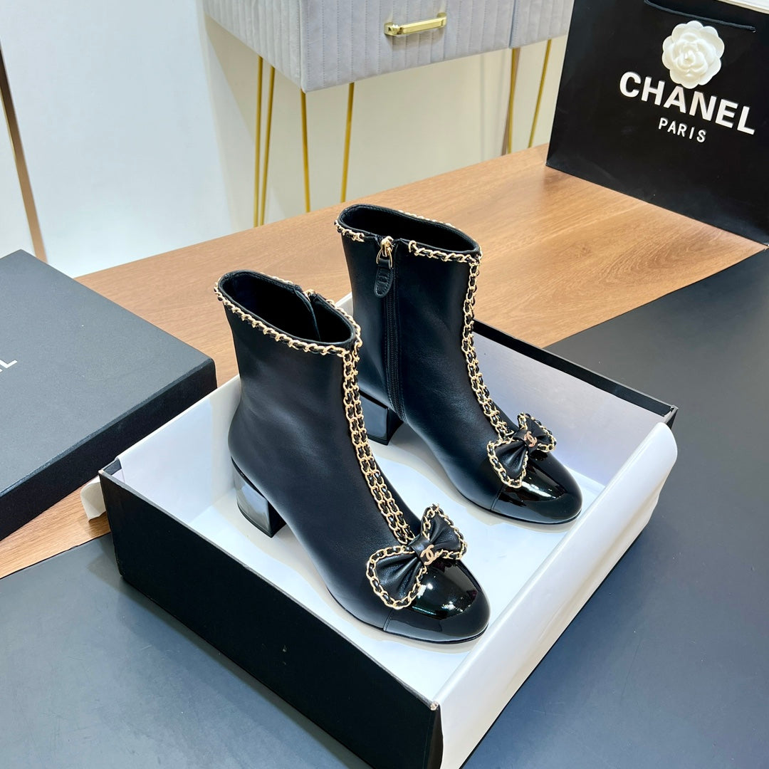 CHANEL 25S HEELED CHAIN BOOTS WITH BOW IN BLACK CALFSKIN GOLD HARDWRE - 35