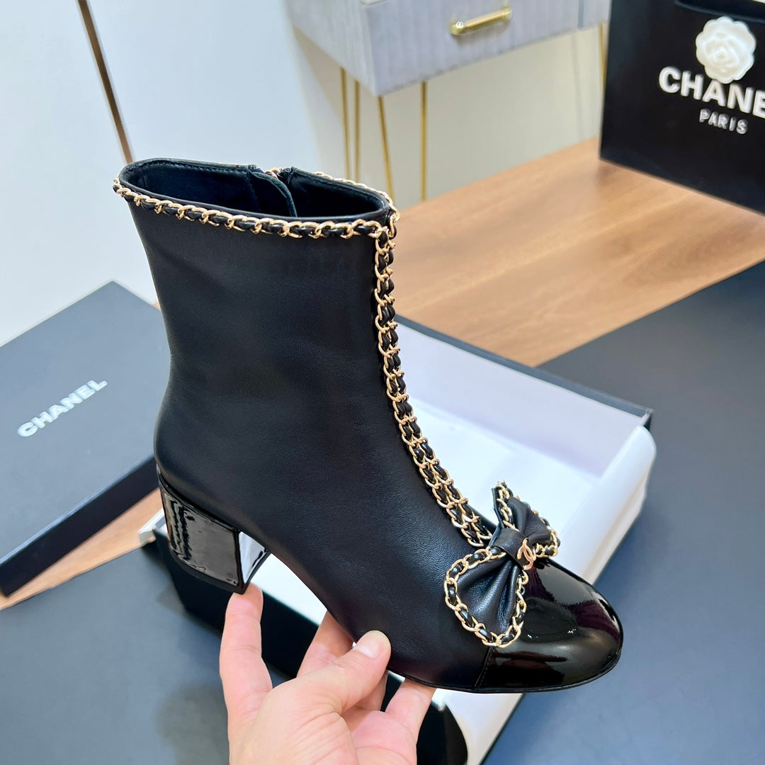 CHANEL 25S HEELED CHAIN BOOTS WITH BOW IN BLACK CALFSKIN GOLD HARDWRE - 35