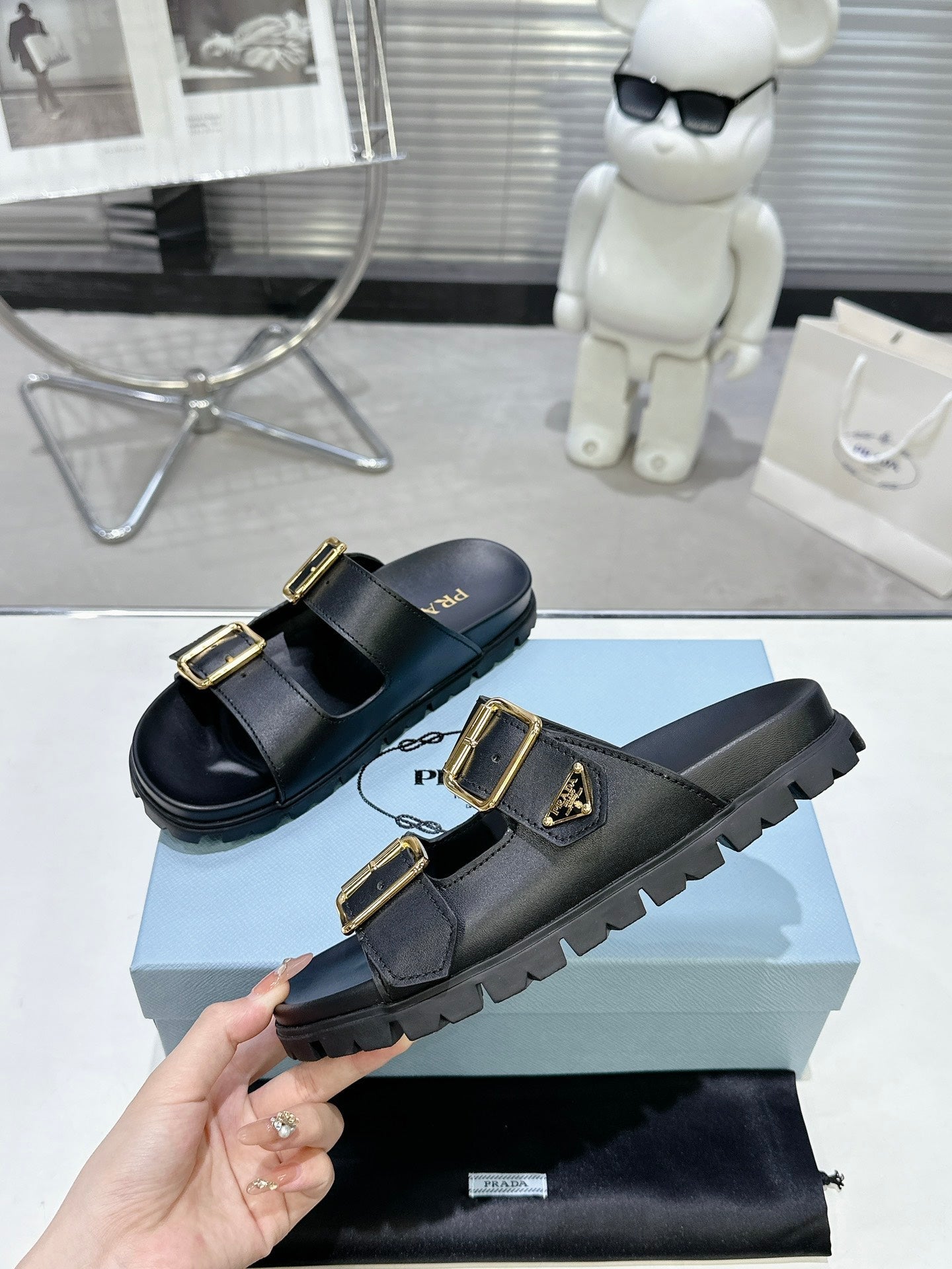 PRADA 25S STRAP SLIDES 30MM IN BLACK CALFSKIN GOLD HARDWARE - 35