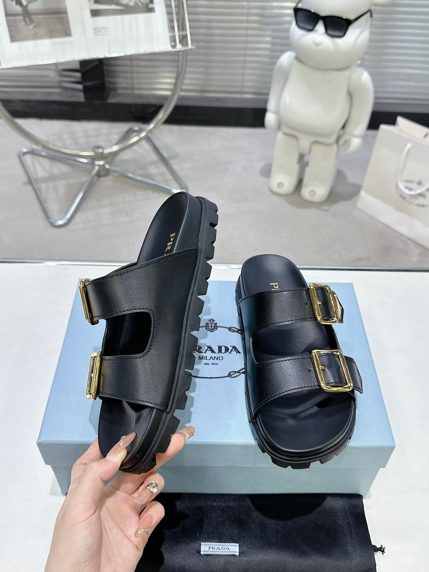 PRADA 25S STRAP SLIDES 30MM IN BLACK CALFSKIN GOLD HARDWARE - 35