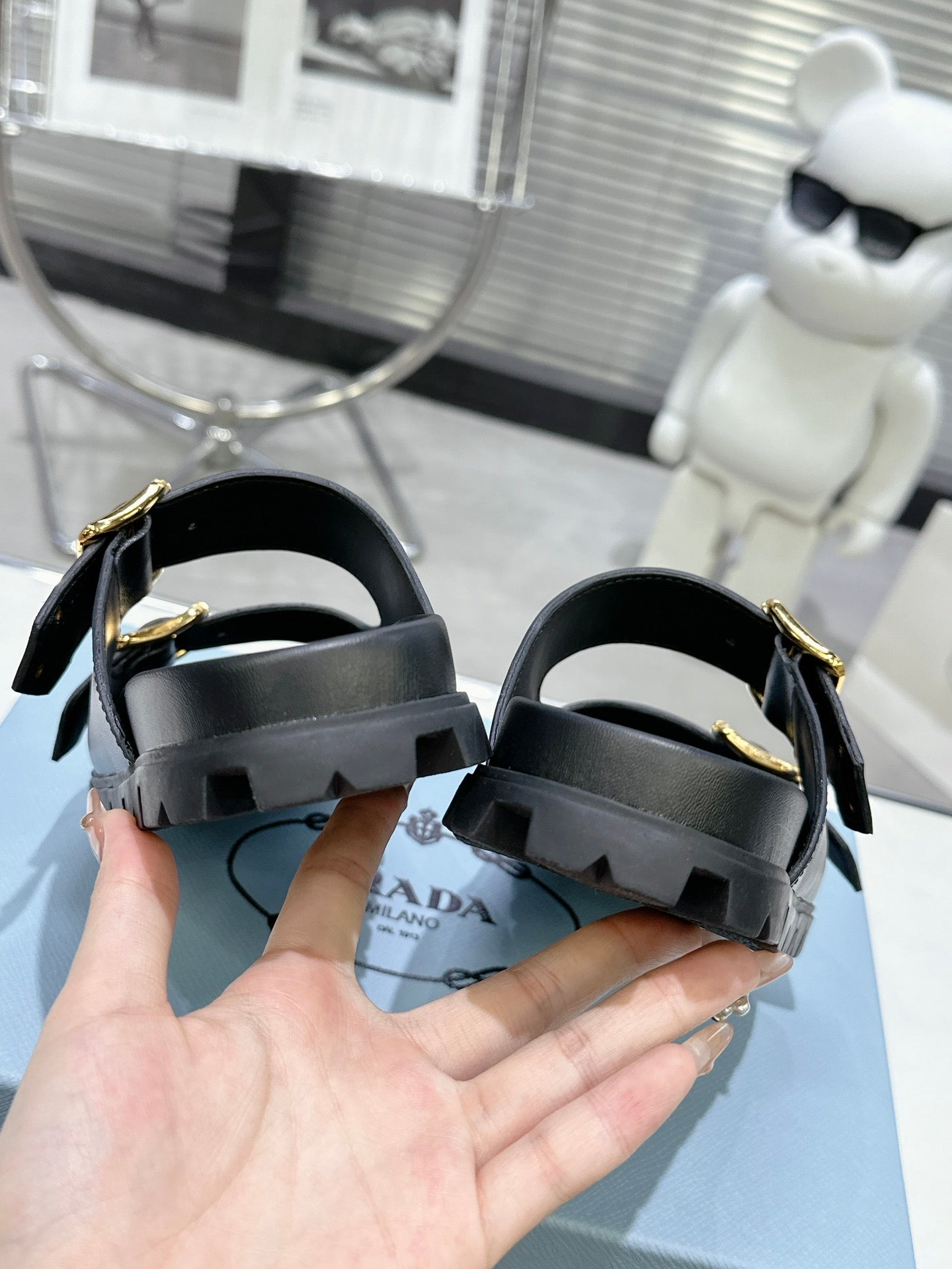PRADA 25S STRAP SLIDES 30MM IN BLACK CALFSKIN GOLD HARDWARE - 35