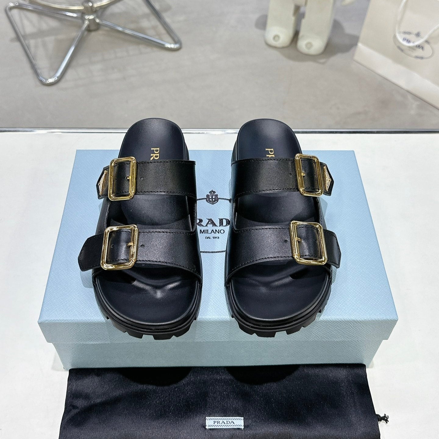 PRADA 25S STRAP SLIDES 30MM IN BLACK CALFSKIN GOLD HARDWARE - 35