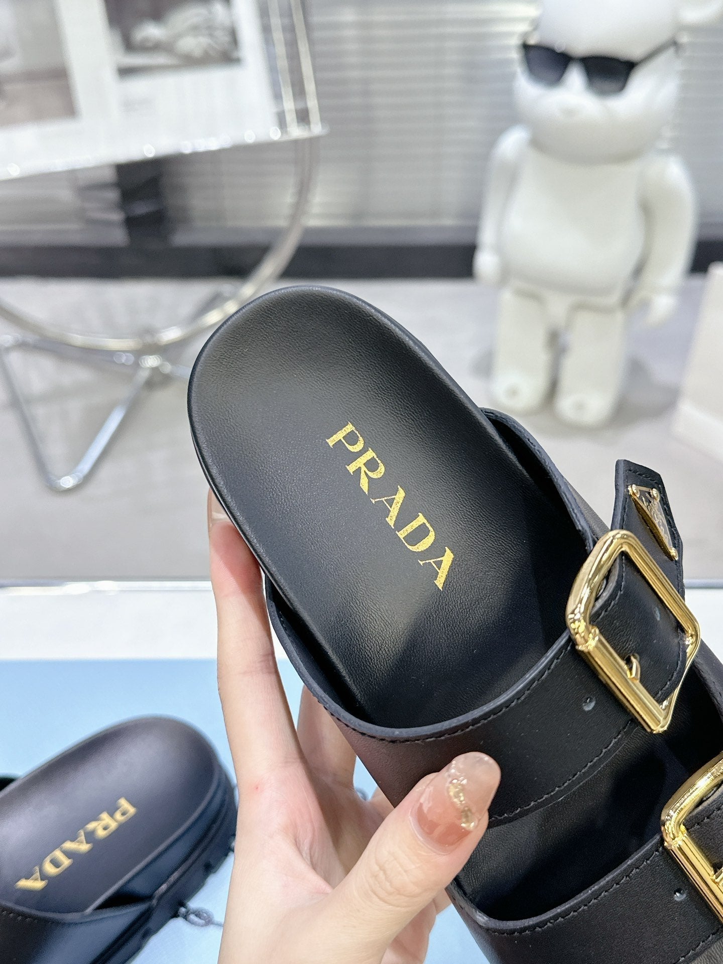 PRADA 25S STRAP SLIDES 30MM IN BLACK CALFSKIN GOLD HARDWARE - 35
