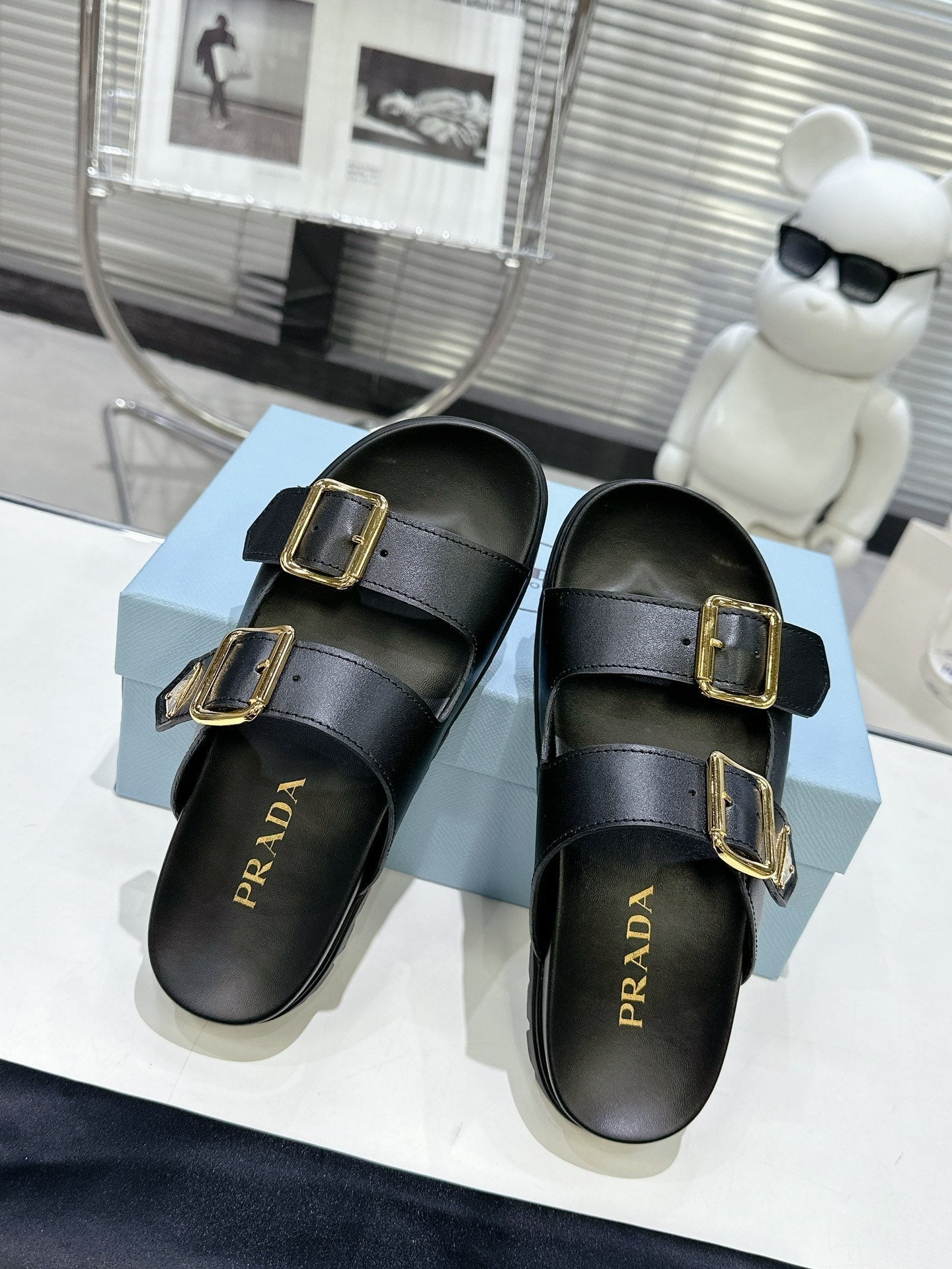 PRADA 25S STRAP SLIDES 30MM IN BLACK CALFSKIN GOLD HARDWARE - 35