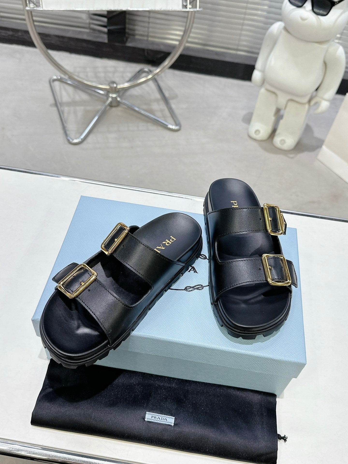 PRADA 25S STRAP SLIDES 30MM IN BLACK CALFSKIN GOLD HARDWARE - 35