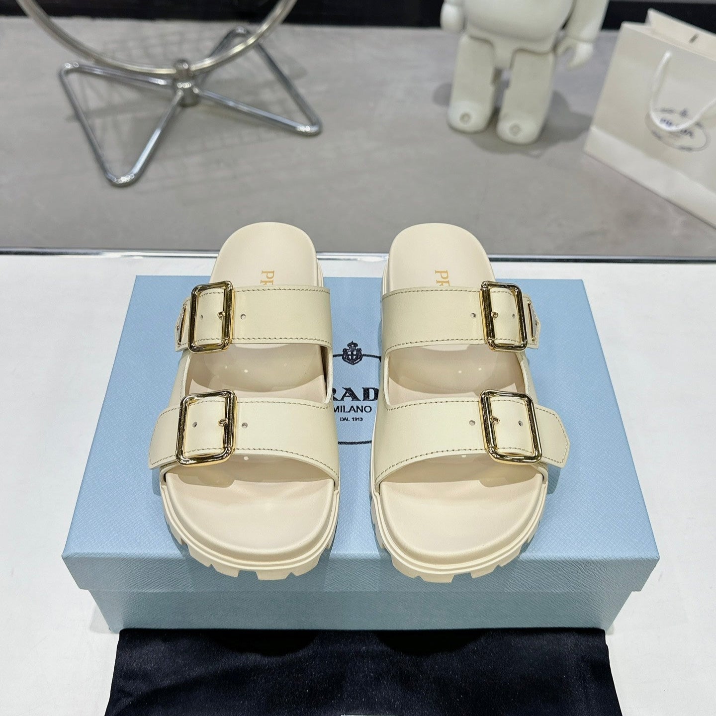 PRADA 25S STRAP SLIDES 30MM IN CREAM CALFSKIN GOLD HARDWARE - 35