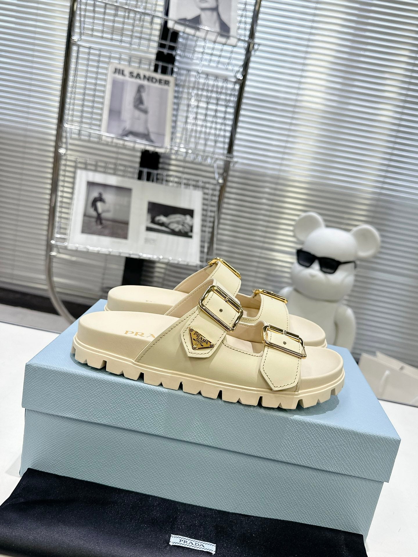 PRADA 25S STRAP SLIDES 30MM IN CREAM CALFSKIN GOLD HARDWARE - 35
