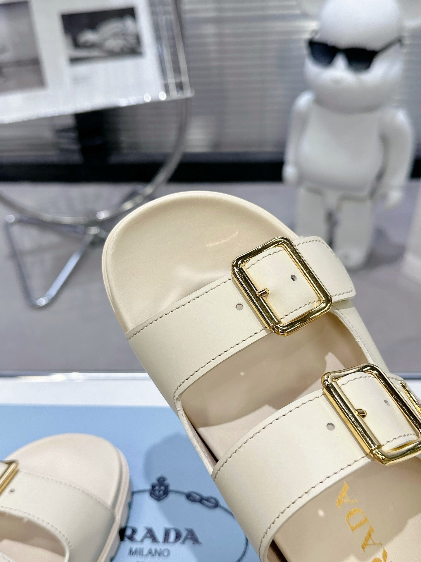 PRADA 25S STRAP SLIDES 30MM IN CREAM CALFSKIN GOLD HARDWARE - 35
