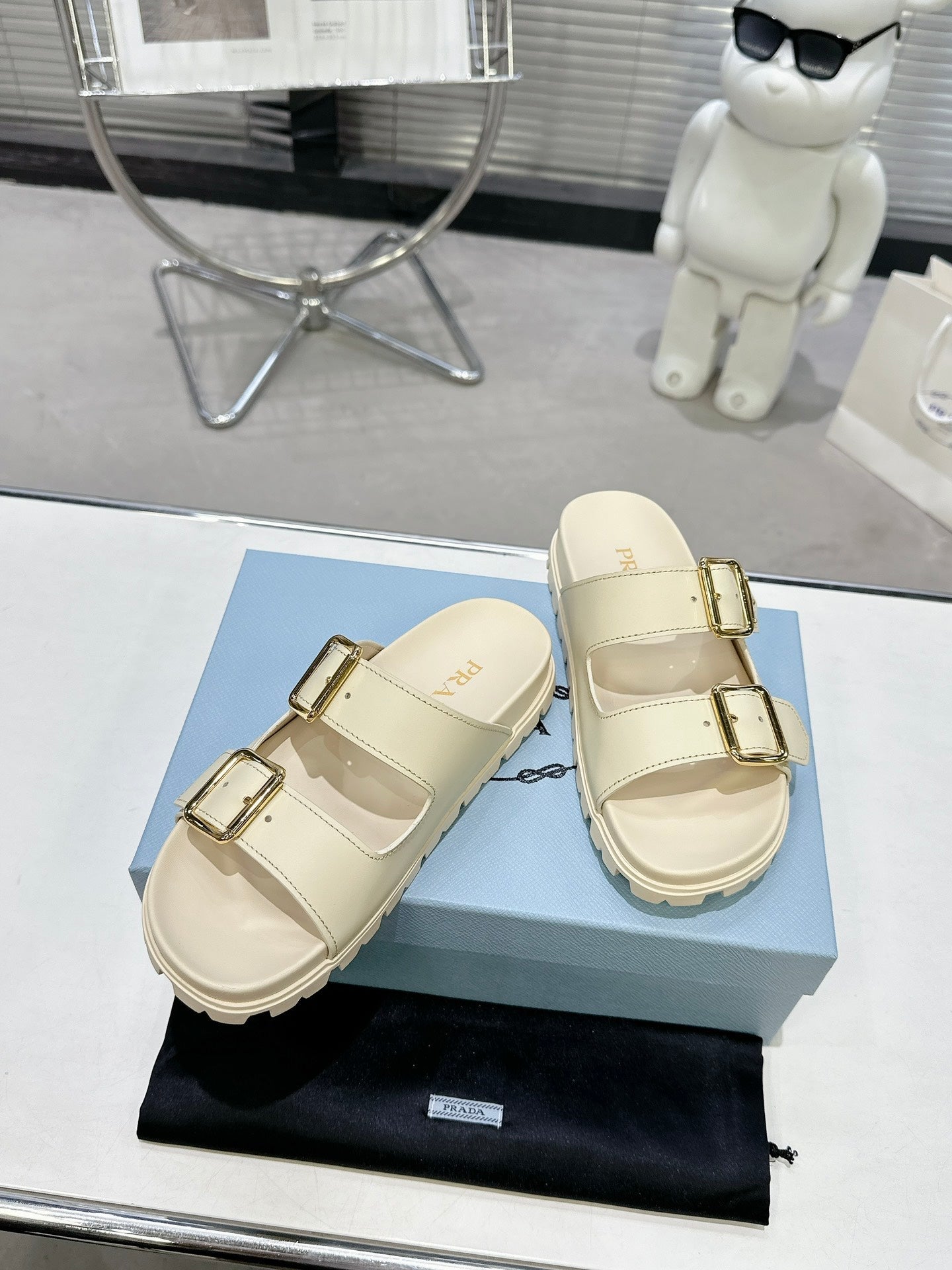 PRADA 25S STRAP SLIDES 30MM IN CREAM CALFSKIN GOLD HARDWARE - 35