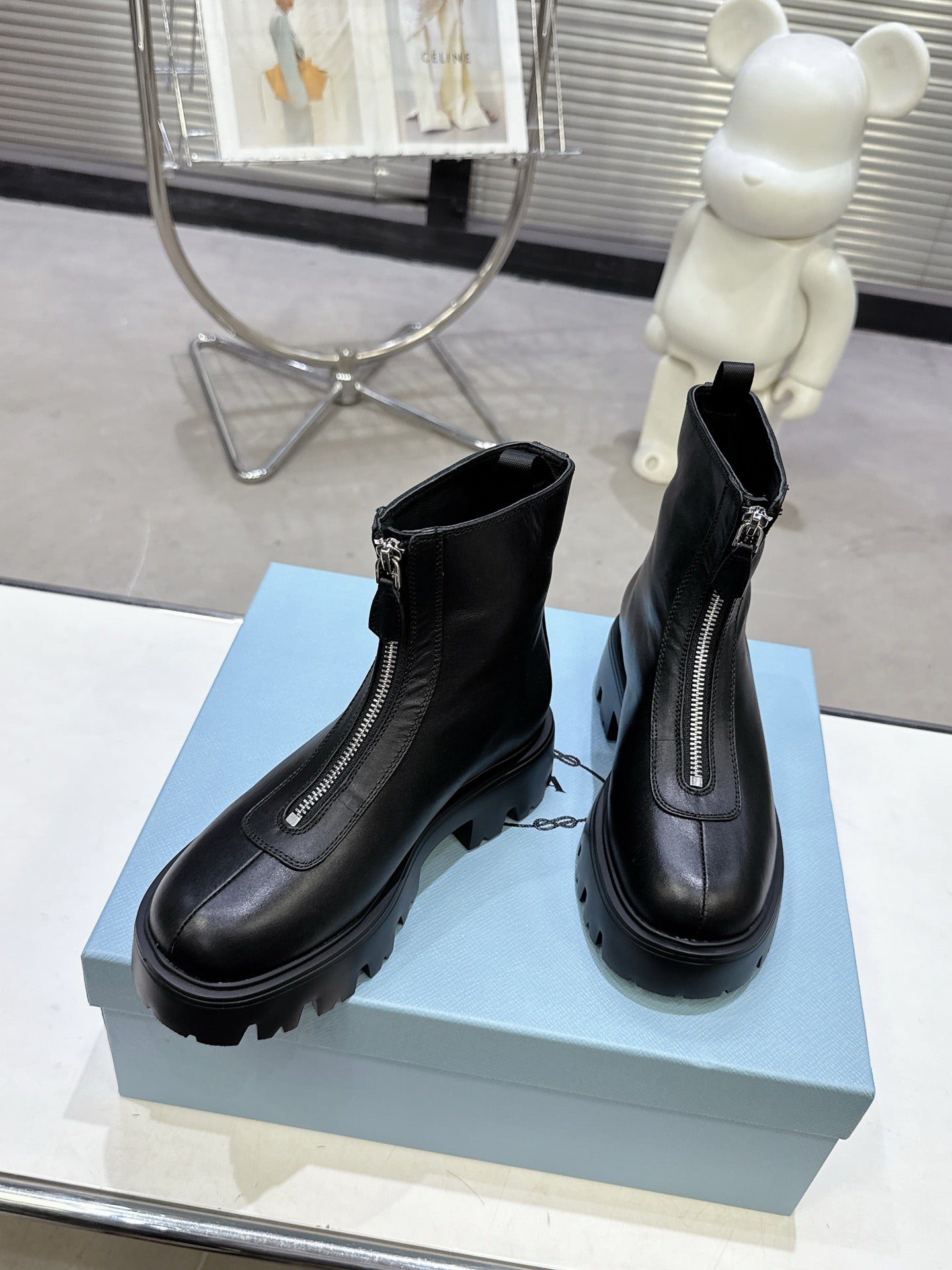 PRADA 25S ZIP-UP ANKLE BOOTS IN BLACK CALFSKIN - 35