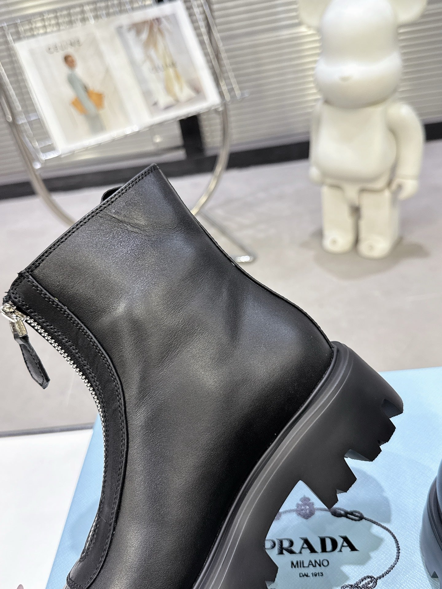 PRADA 25S ZIP-UP ANKLE BOOTS IN BLACK CALFSKIN - 35