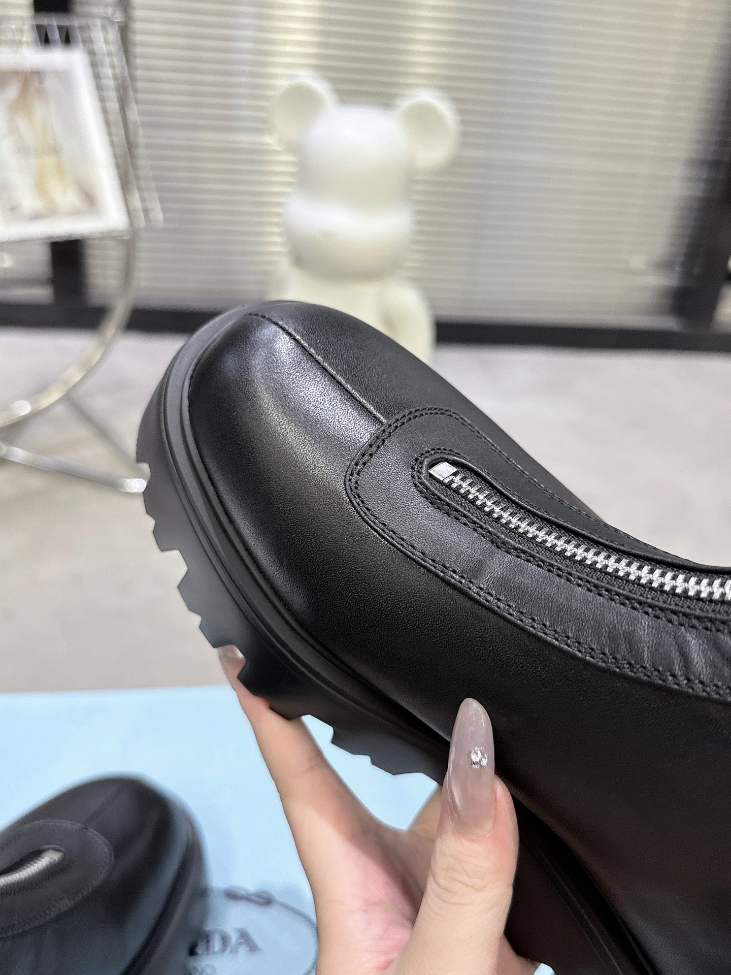 PRADA 25S ZIP-UP ANKLE BOOTS IN BLACK CALFSKIN - 35