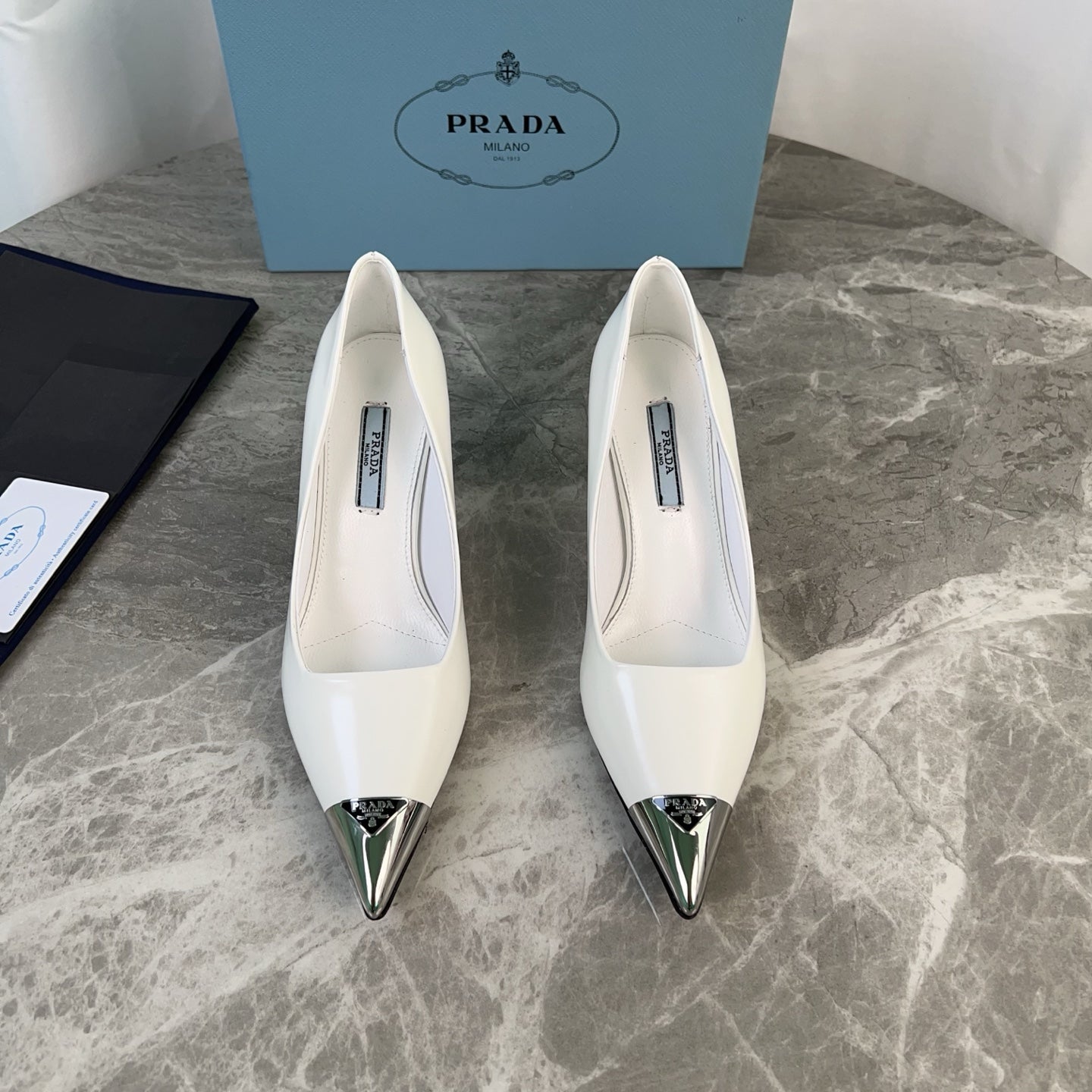 PRADA 25S METAL-CAPPED POINTED-TOE HIGH HEELS IN WHITE CALFSKIN - 34