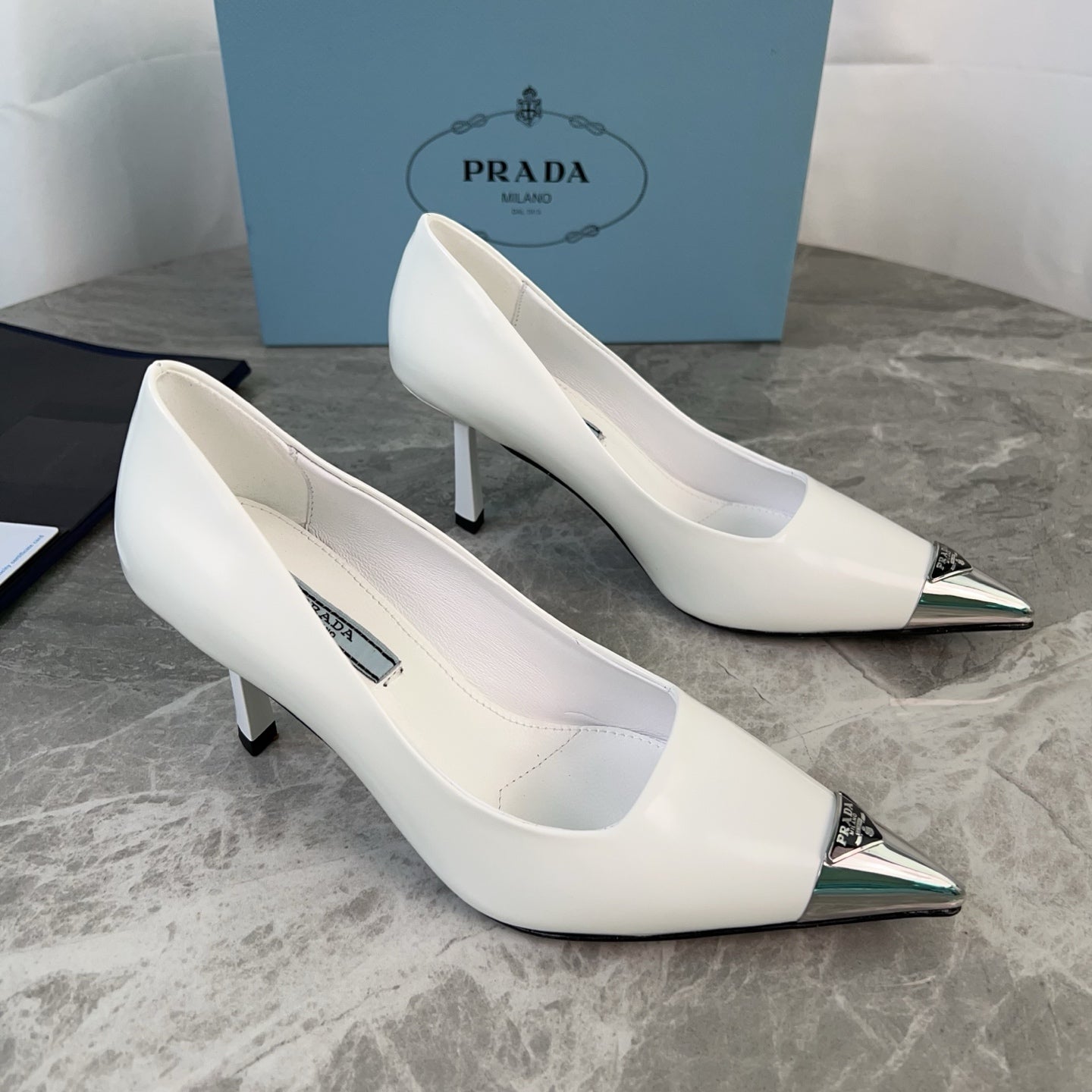 PRADA 25S METAL-CAPPED POINTED-TOE HIGH HEELS IN WHITE CALFSKIN - 34