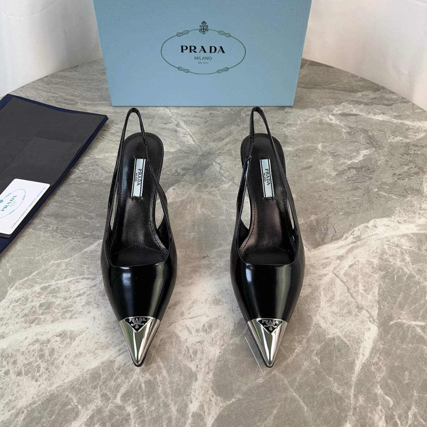 PRADA 25S METAL-TOE SLINGBACK PUMPS IN BLACK CALFSKIN - 34