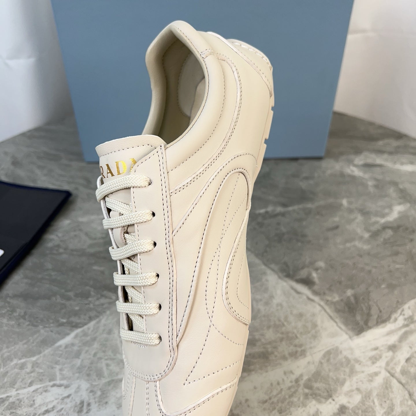 PRADA 25S MONTECARLO ANTIQUED SNEAKERS IN CHALK WHITE NAPPA LEATHER - 35