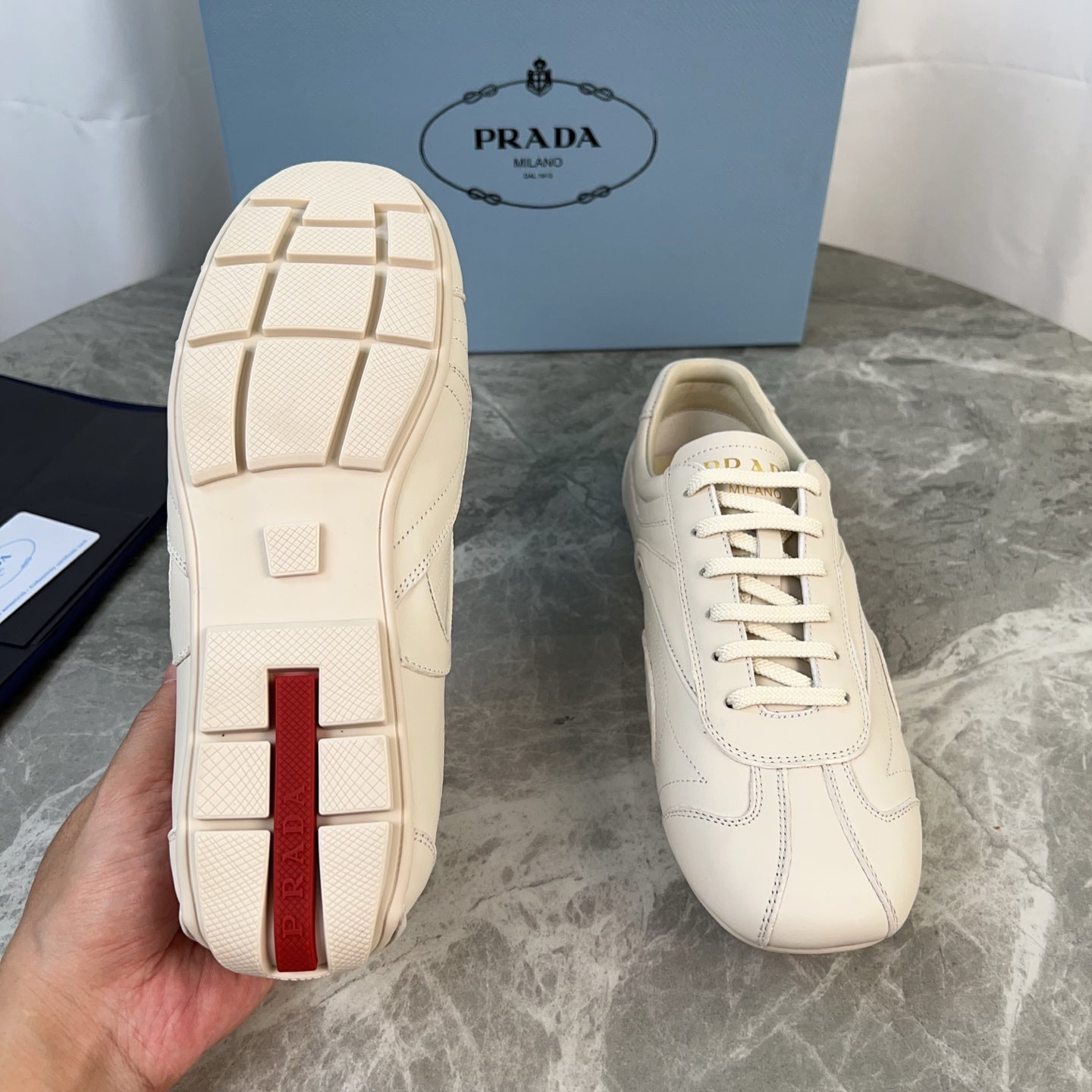 PRADA 25S MONTECARLO ANTIQUED SNEAKERS IN CHALK WHITE NAPPA LEATHER - 35