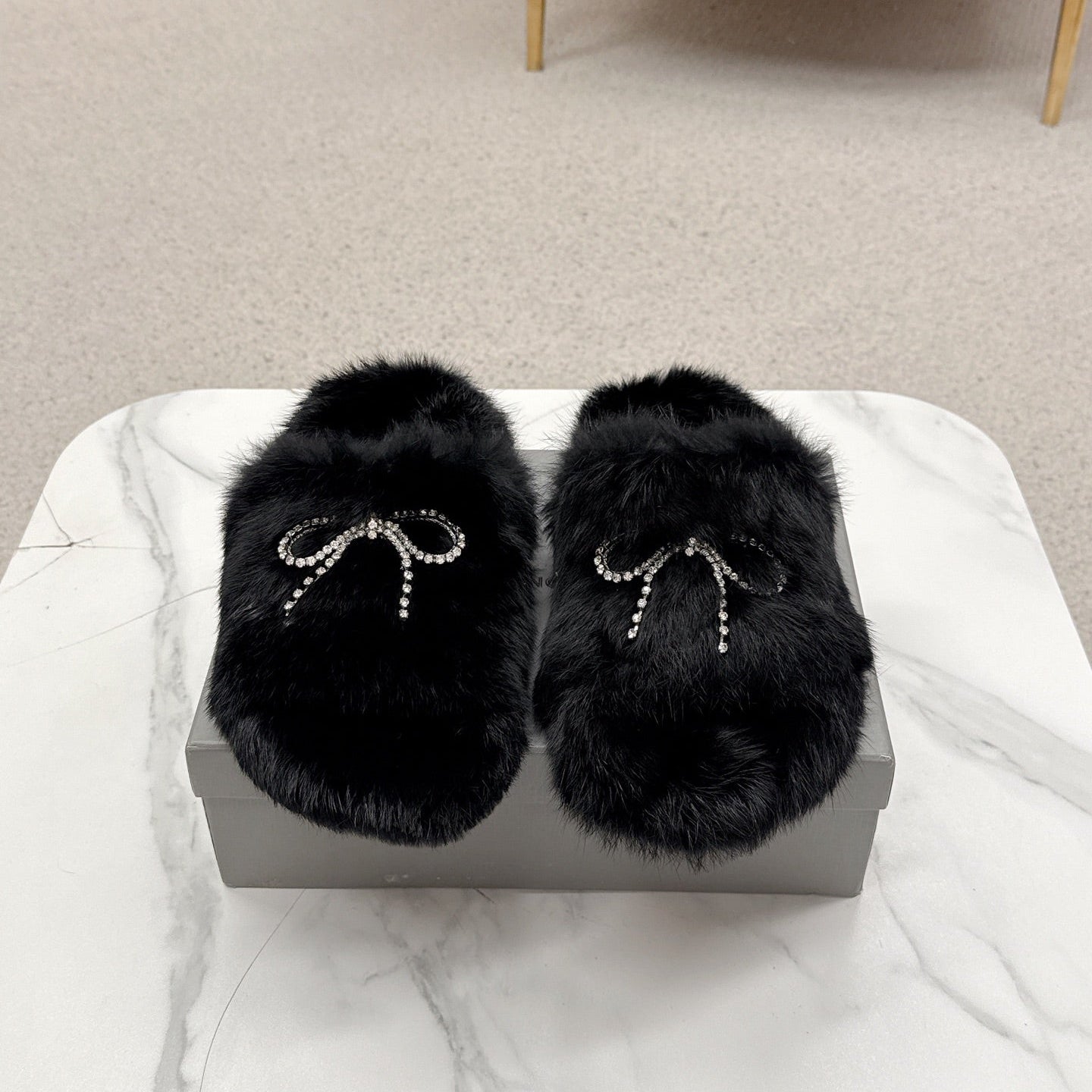 BALENCIAGA 25S SOFT FUR SLIPPERS IN BLACK FUR WITH RHINESTONE BOW - 35