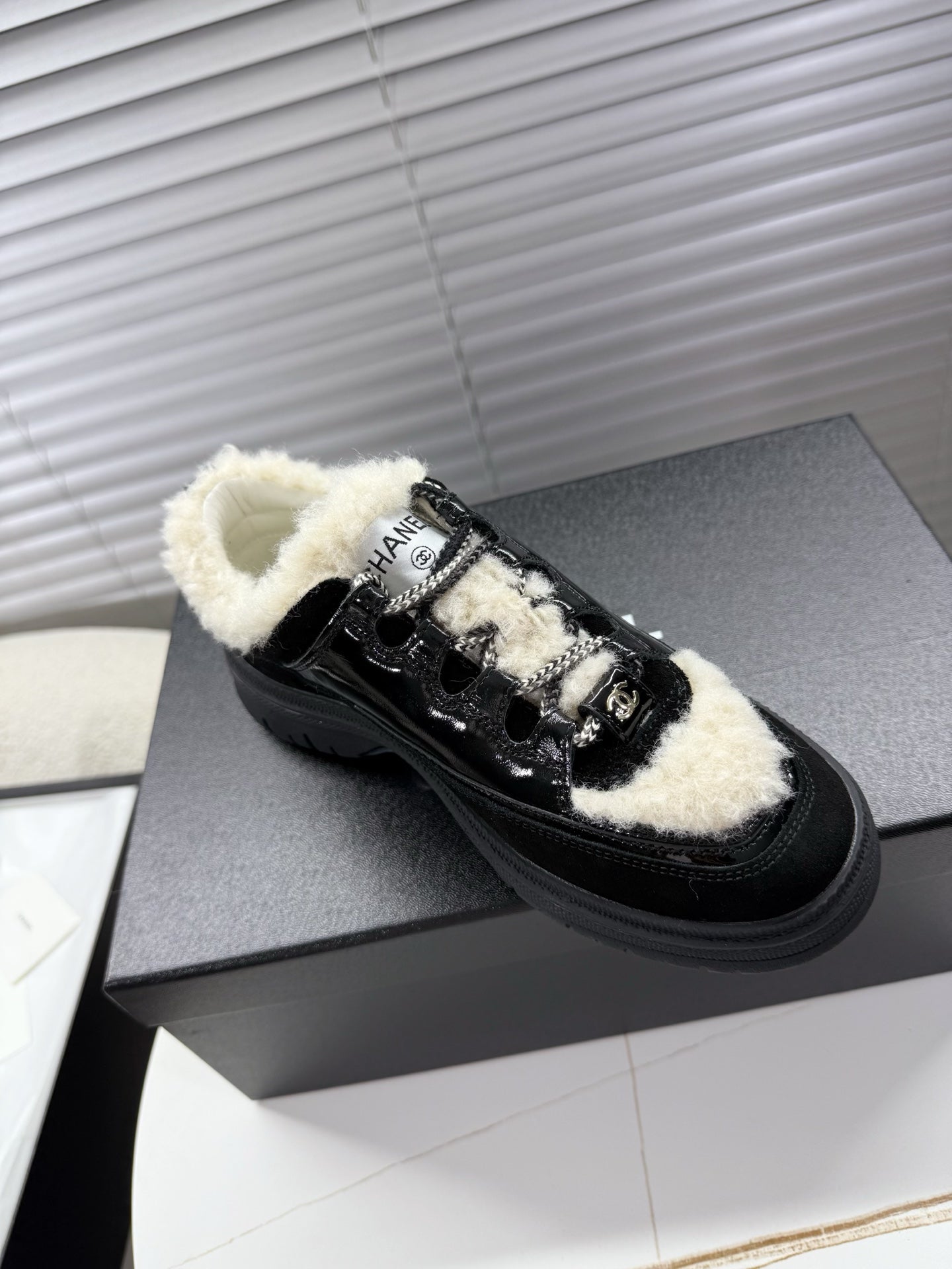 CHANEL 25S SNEAKERS WITH FUR ACCENTS 35MM IN BLACK CALFSKIN - 35
