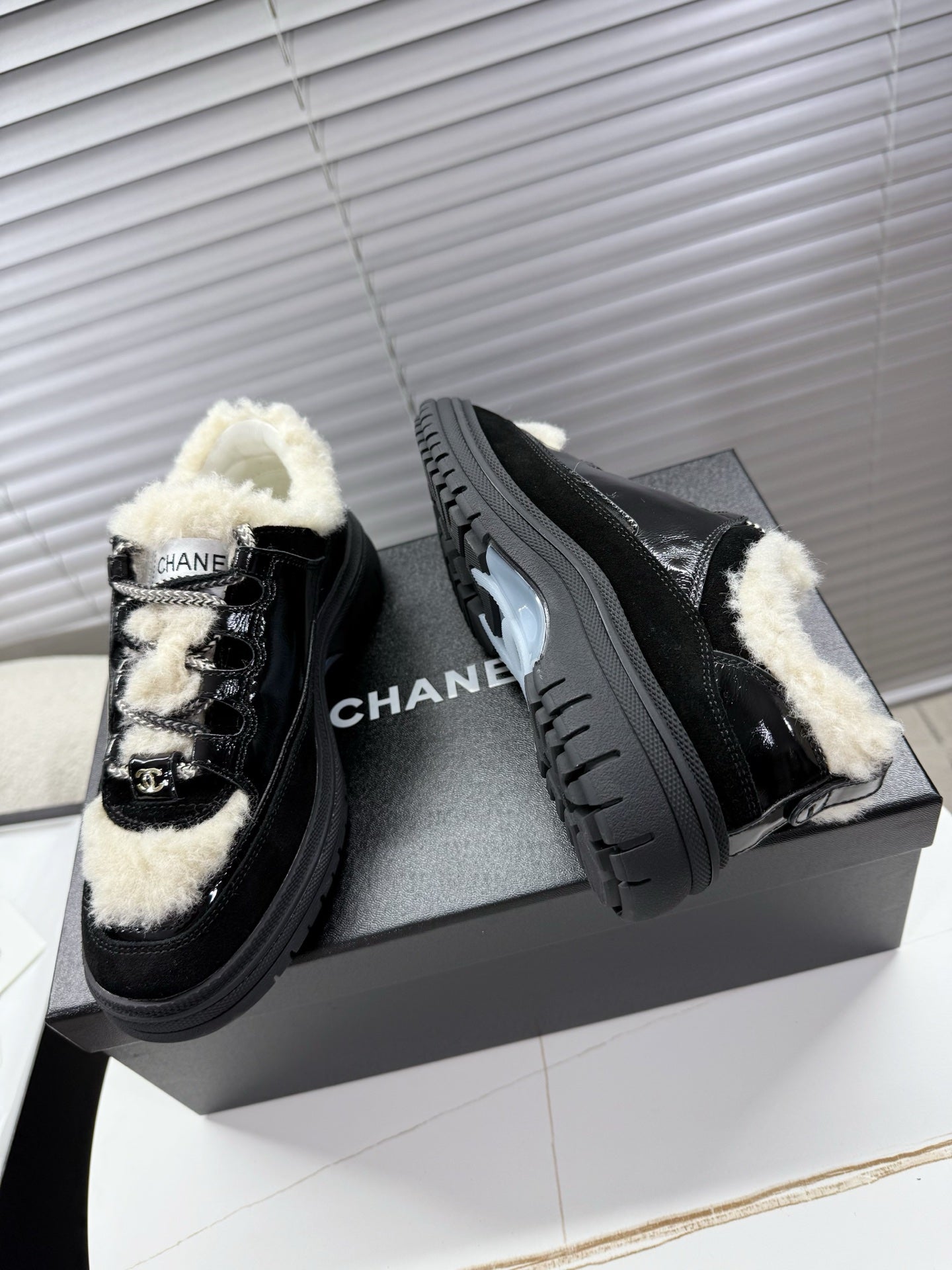 CHANEL 25S SNEAKERS WITH FUR ACCENTS 35MM IN BLACK CALFSKIN - 35
