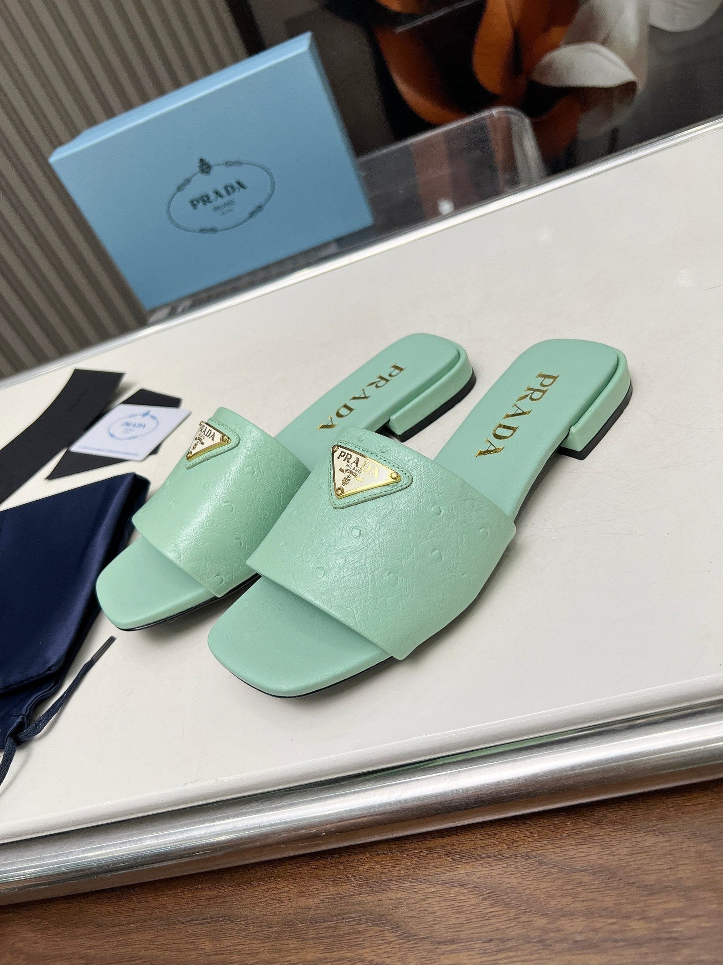 PRA SAFFIANO PATENT SLIDES OSTRICH MOTIF SEAFOAM CALFSKIN - 35