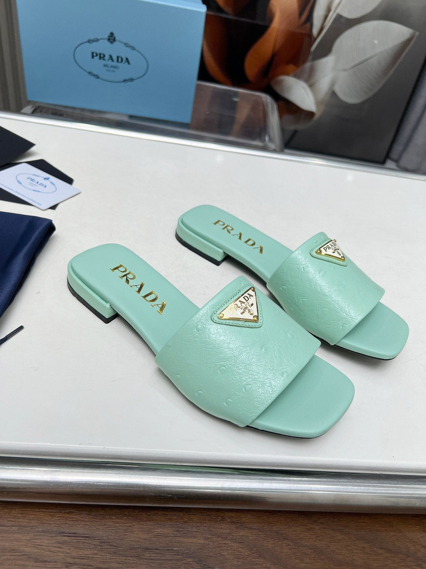 PRA SAFFIANO PATENT SLIDES OSTRICH MOTIF SEAFOAM CALFSKIN - 35