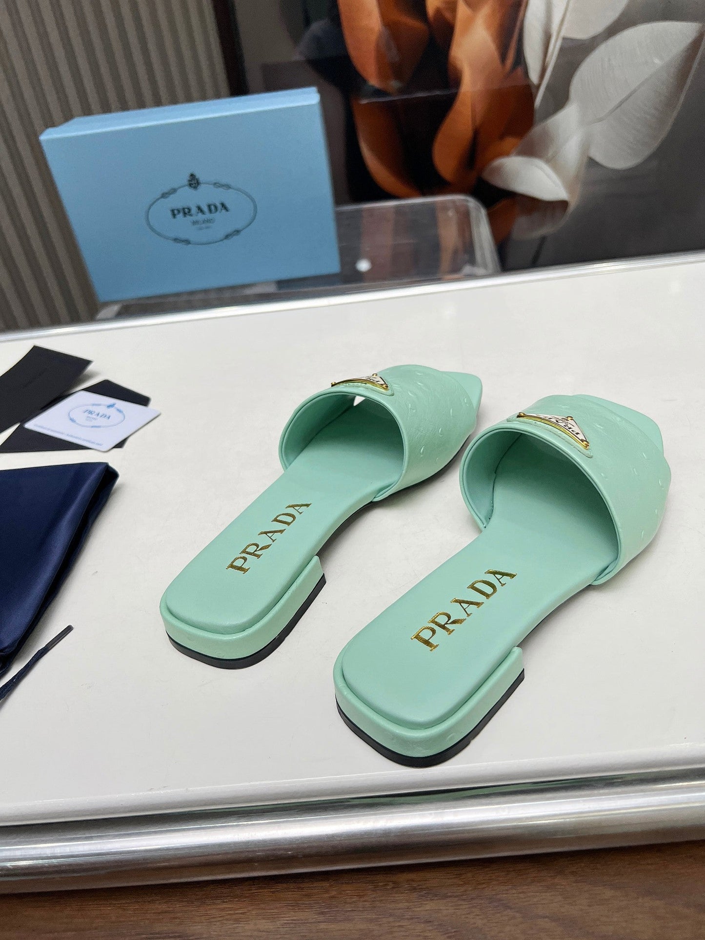 PRA SAFFIANO PATENT SLIDES OSTRICH MOTIF SEAFOAM CALFSKIN - 35