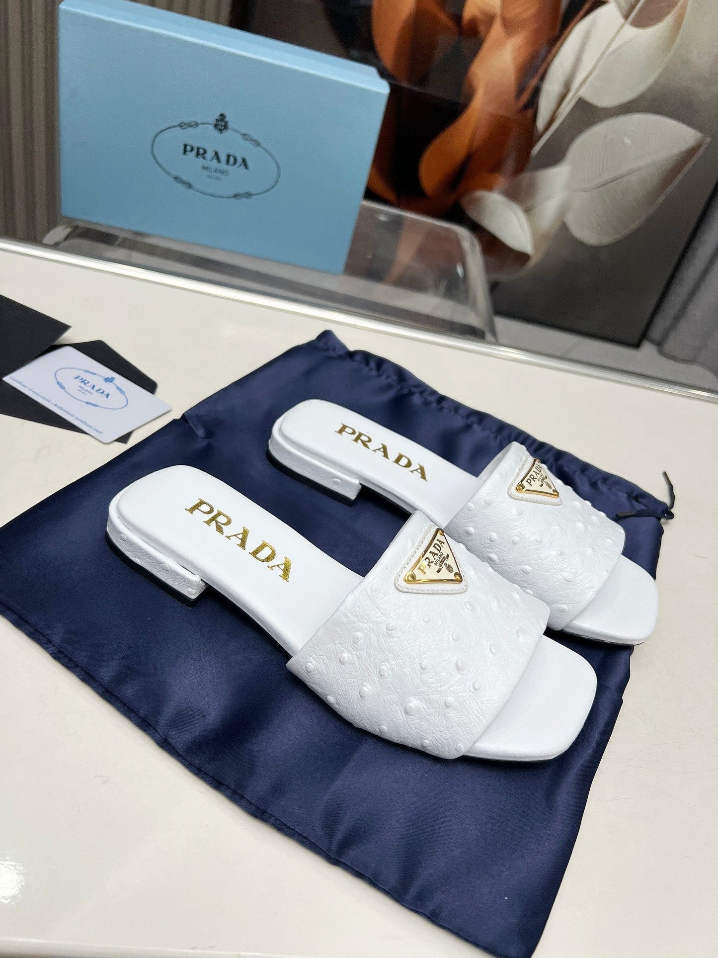 PRA SAFFIANO PATENT SLIDES OSTRICH MOTIF WHITE CALFSKIN - 35