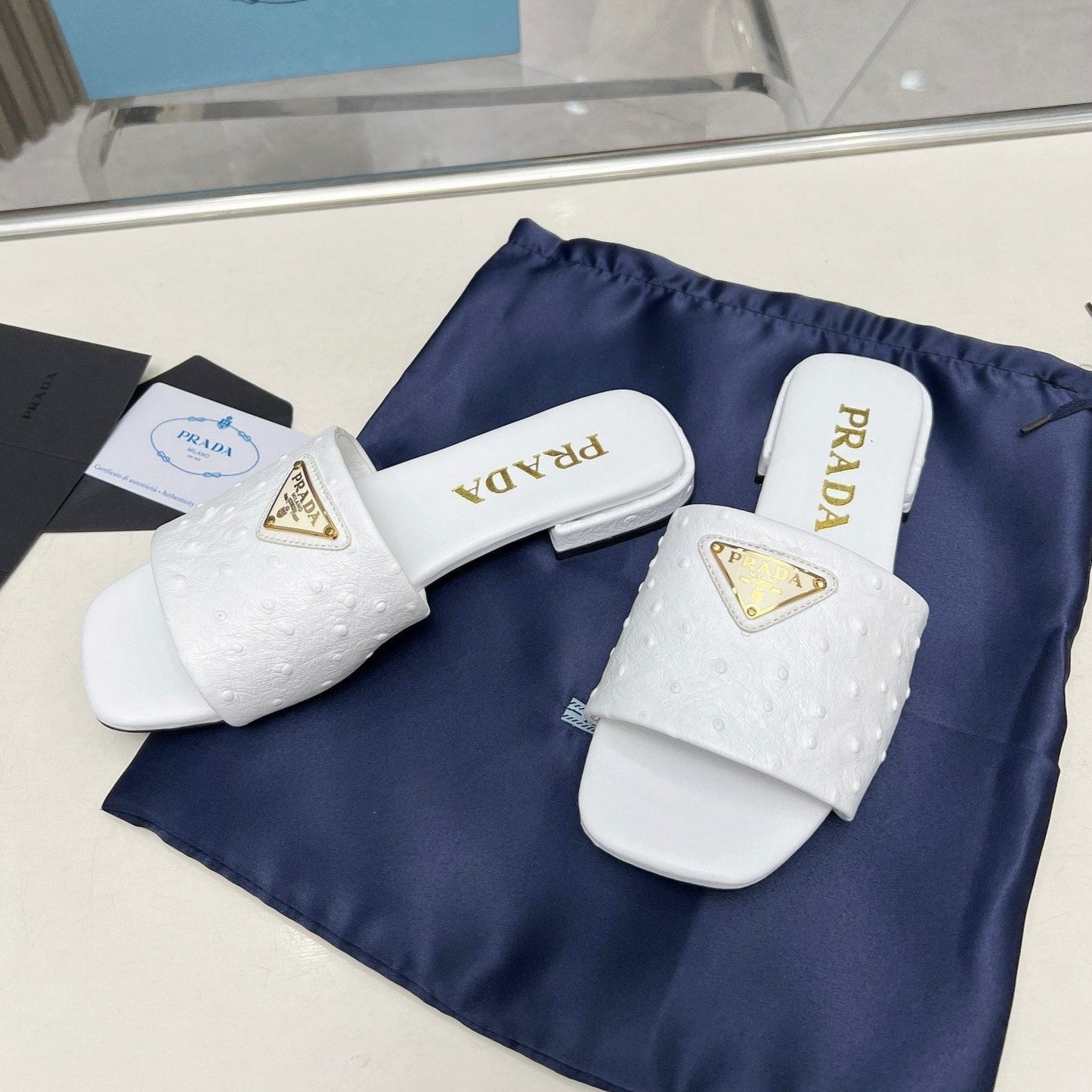 PRA SAFFIANO PATENT SLIDES OSTRICH MOTIF WHITE CALFSKIN - 35