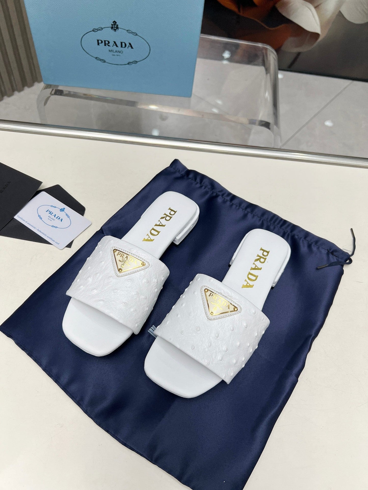 PRA SAFFIANO PATENT SLIDES OSTRICH MOTIF WHITE CALFSKIN - 35