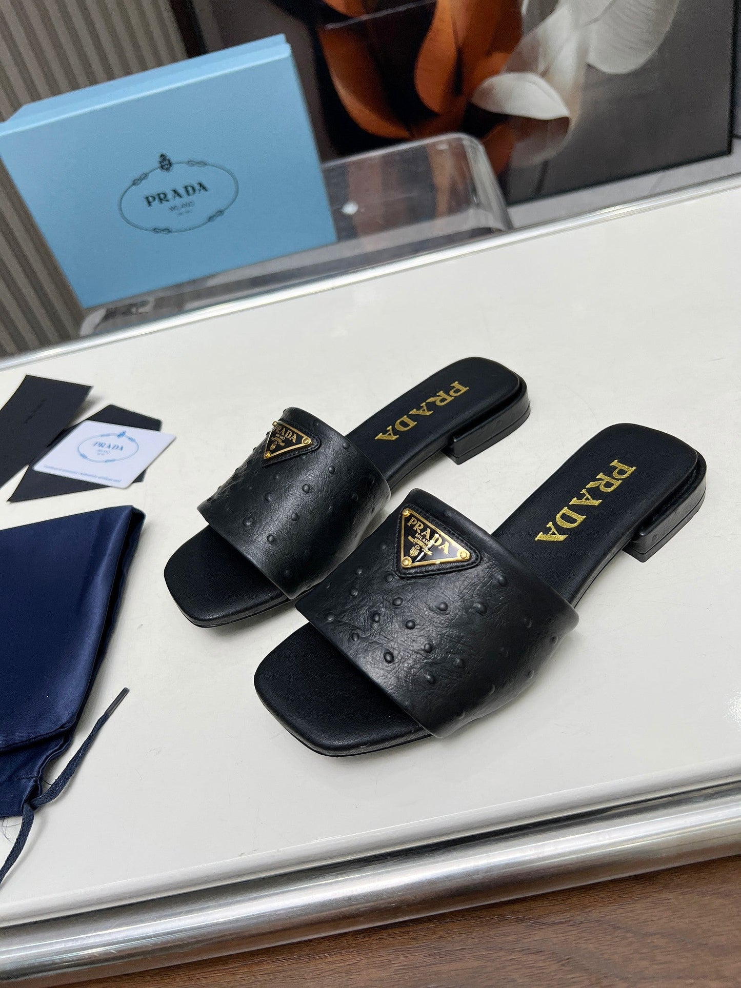 PRA SAFFIANO PATENT SLIDES OSTRICH MOTIF BLACK CALFSKIN - 35
