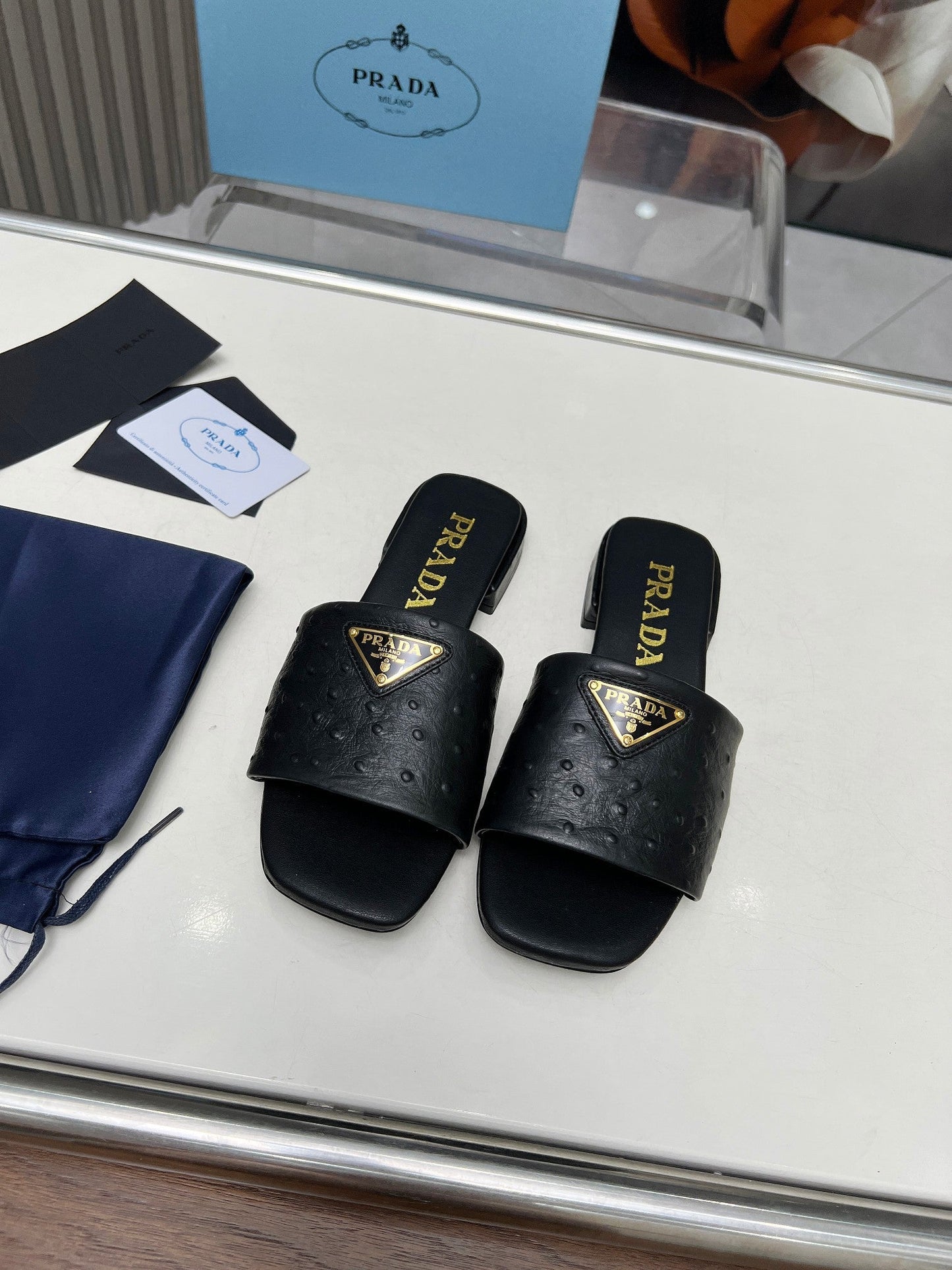 PRA SAFFIANO PATENT SLIDES OSTRICH MOTIF BLACK CALFSKIN - 35